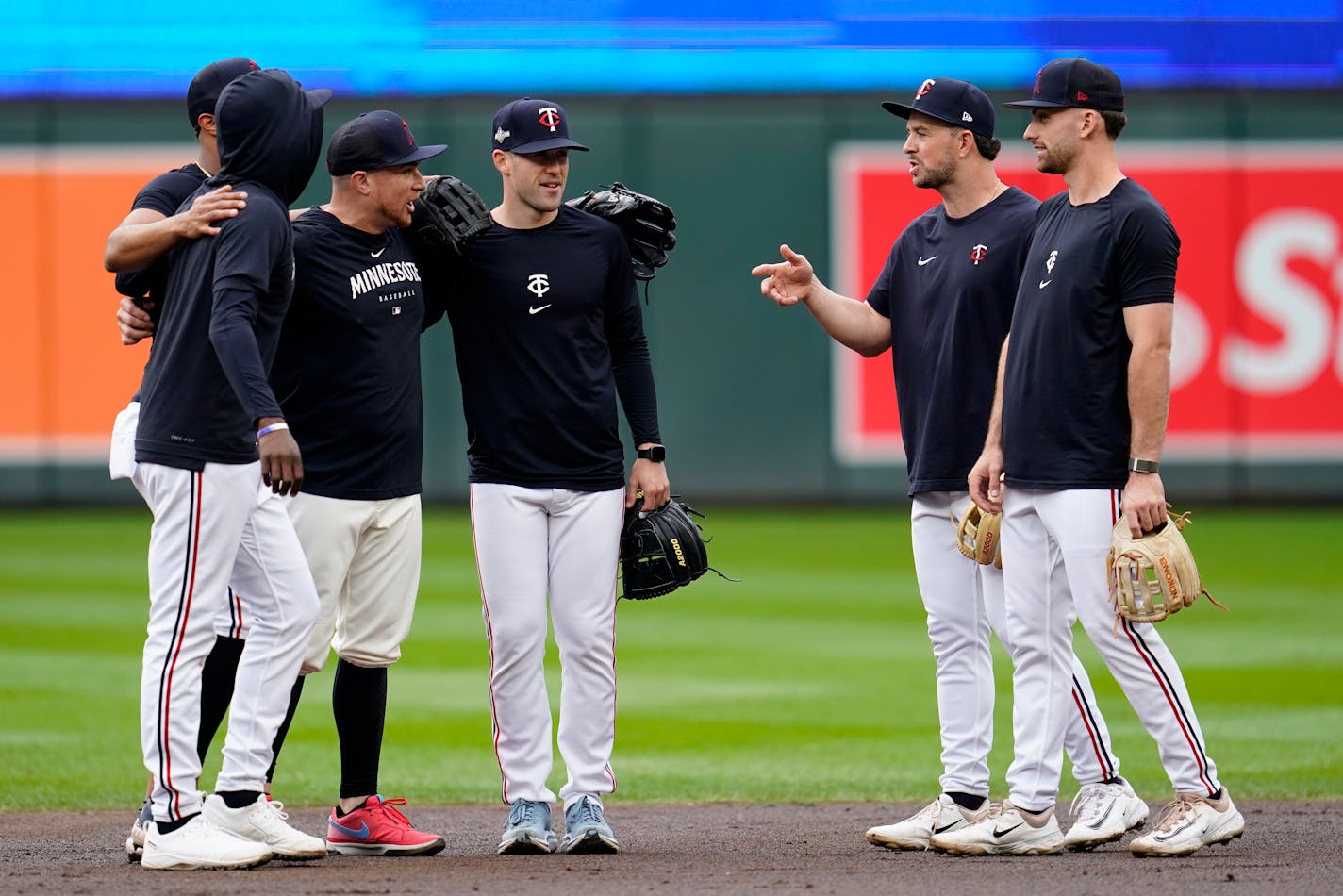 Minnesota Twins players stand together before Game 2 of an AL wild-card baseball playoff series against the Toronto Blue Jays, Wednesday, Oct. 4, 2023, in Minneapolis. (AP Photo/Abbie Parr)