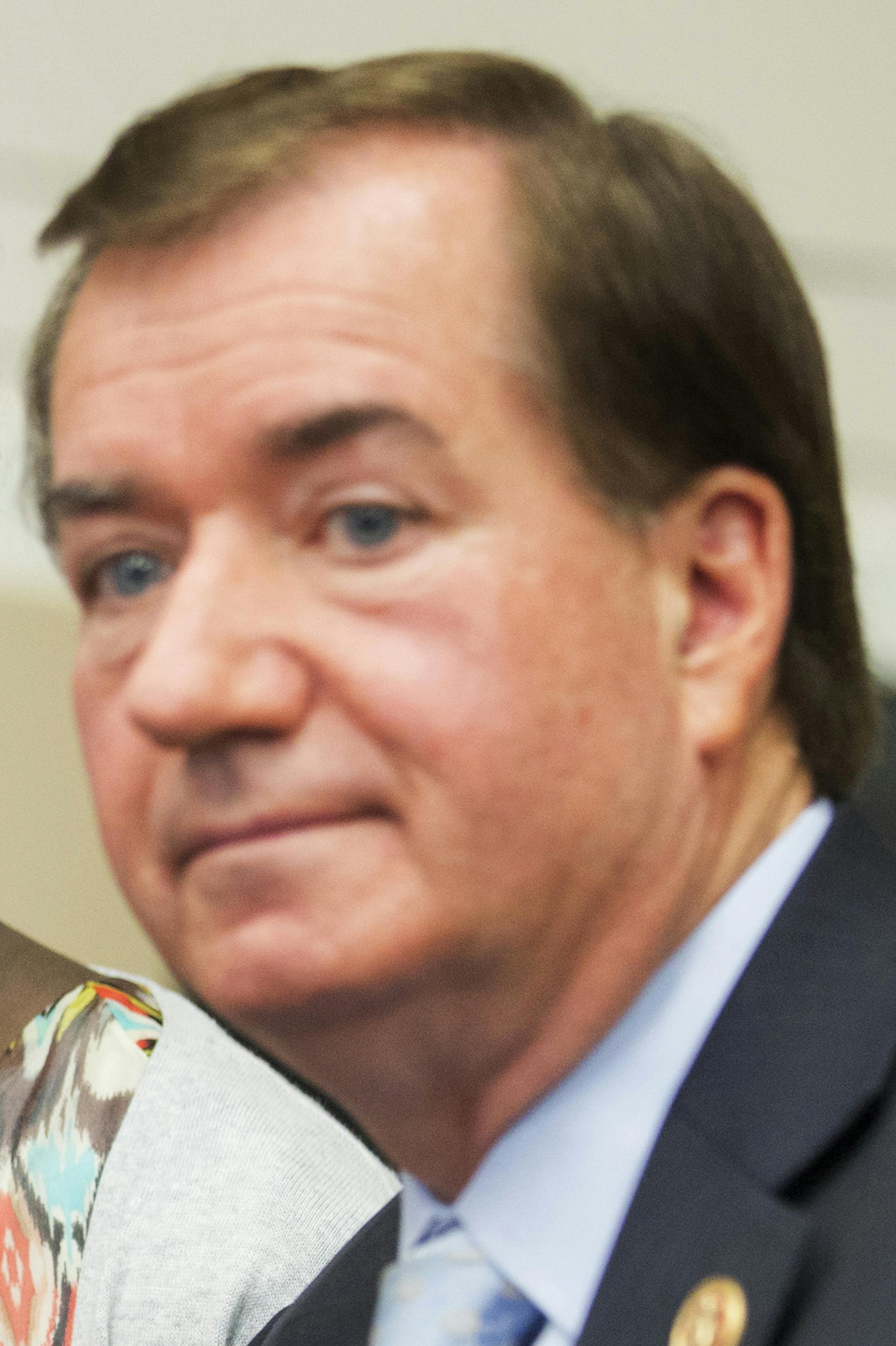 Deborah Peter, center, holds up a sign, flanked by House Foreign Affairs Committee Chairman Rep. Ed Royce, R-Calif. right, and the committee's ranking member Rep. Eliot Engel, D-N.Y. during a pre-hearing medial availability on Capitol Hill in Washington, Wednesday, May 21, 2014. Peter, is a sole survivor of a Dec. 11, 2011, Boko Haram attack on her household, where her father and brother were killed for not renouncing their Christian faith. (AP Photo/Manuel Balce Ceneta)