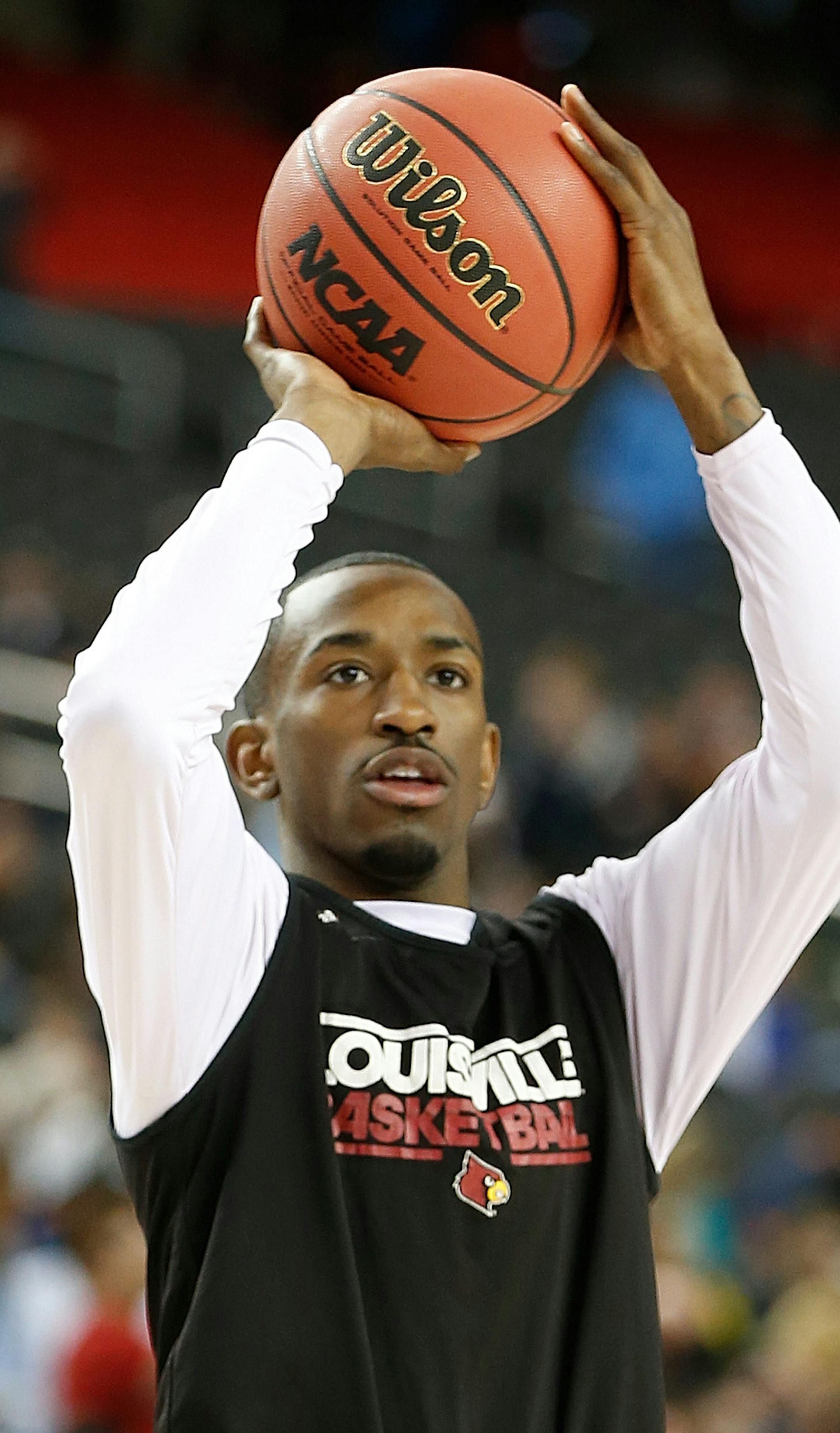 Russ Smith (2) of the Louisville Cardinals shoots as the team practices on Friday, April 5, 2013, in Atlanta, Georgia, n preparation for their semifinal game on Saturday. (Mark Cornelison/Lexington Herald-Leader/MCT)