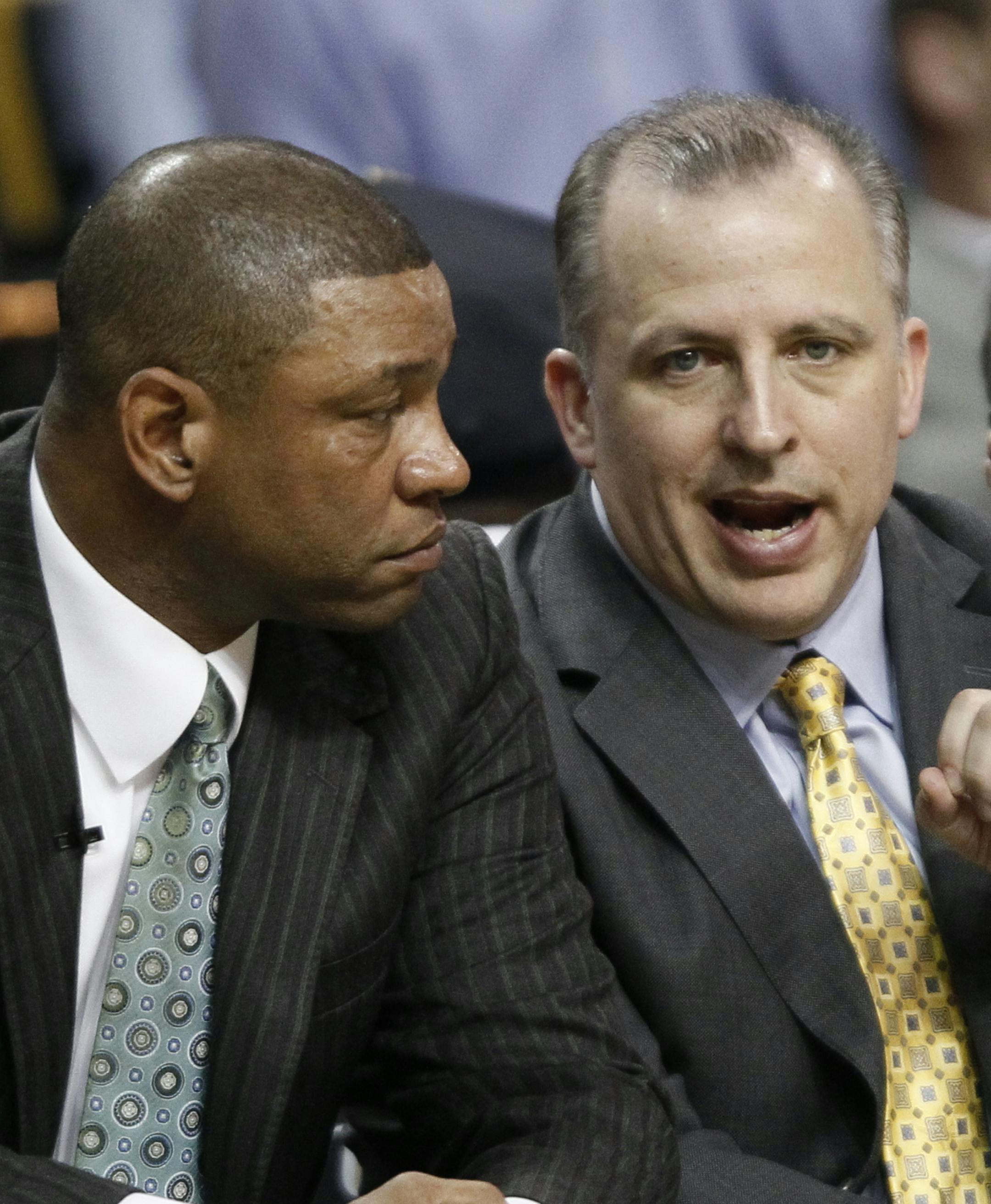 Boston Celtics assistant coach Tom Thibodeau, right, talks to head coach Doc Rivers during Game 4 of the NBA basketball finals against the Los Angeles Lakers Thursday, June 10, 2010, in Boston. (AP Photo/Winslow Townson) ORG XMIT: BXG1