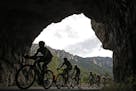 The pack passes through a tunnel in Tarn river canyon during the fourteenth stage of the Tour de France cycling race over 178.5 kilometers (110.9 mile
