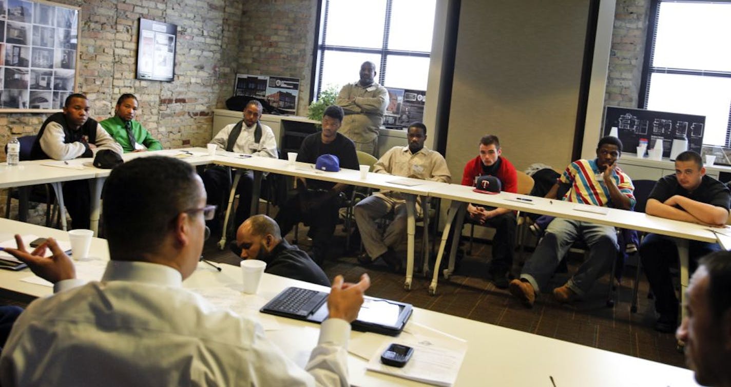 U.S. Rep. Keith Ellison, D-Minn., left, spoke with young men from the North4 group Tuesday. Most of the men are from the high-crime Folwell, Hawthorne, Jordan and McKinley neighborhoods.