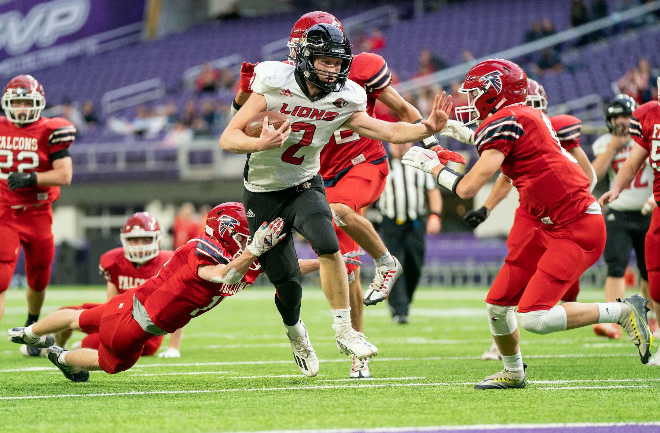 Spring Grove quarterback Elijah Solum shedded Fertile-Beltrami tackles on his way to scoring a rushing touchdown in the first quarter of a Nine-Man semifinal Thursday. He finished with three touchdowns.