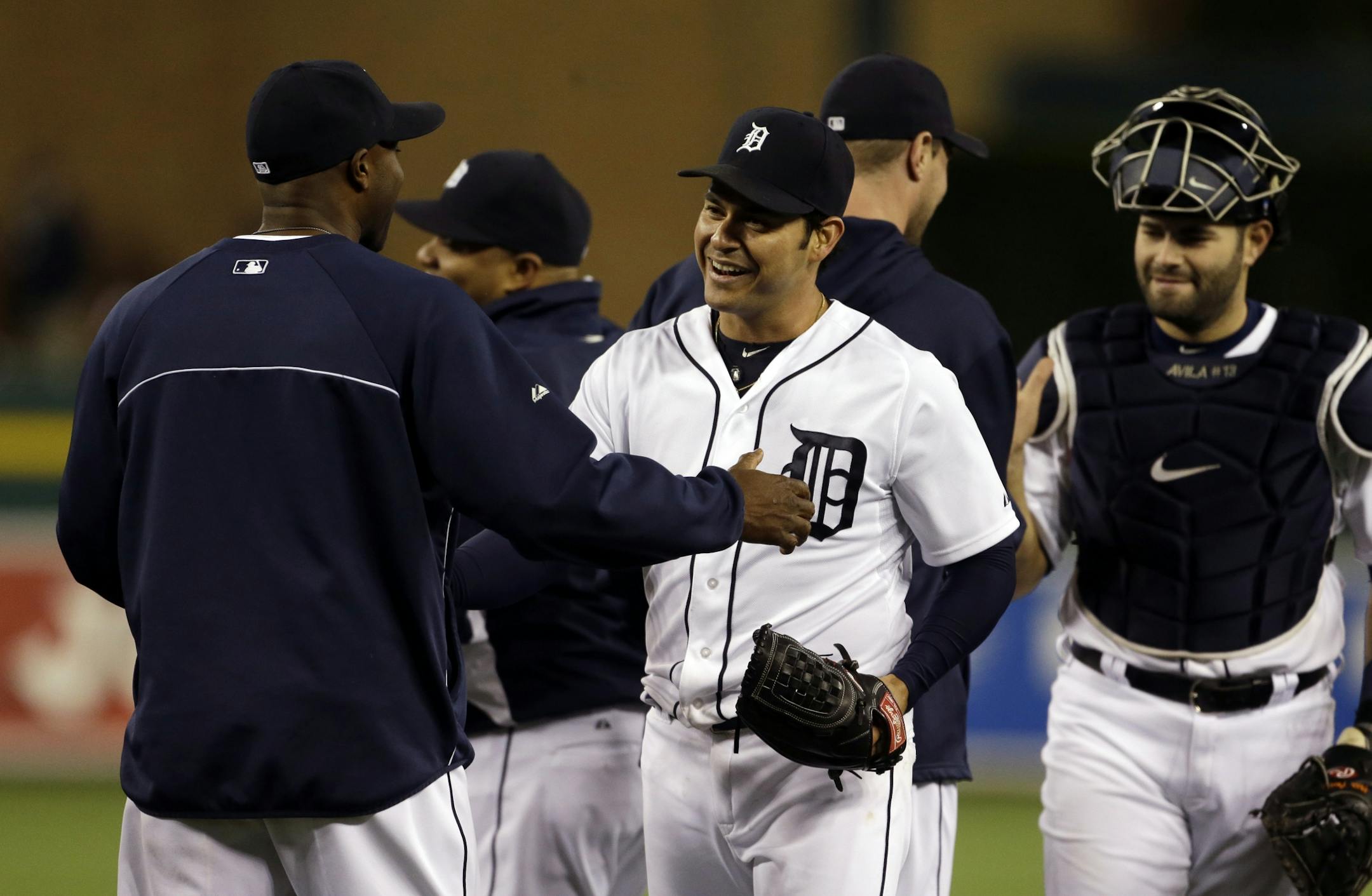 Detroit Tigers starting pitcher Anibal Sanchez, center, greets teammates after the last out in the ninth inning against the Twins in Detroit. Sanchez carried a no-hitter into the ninth until Twins' Joe Mauer singled.