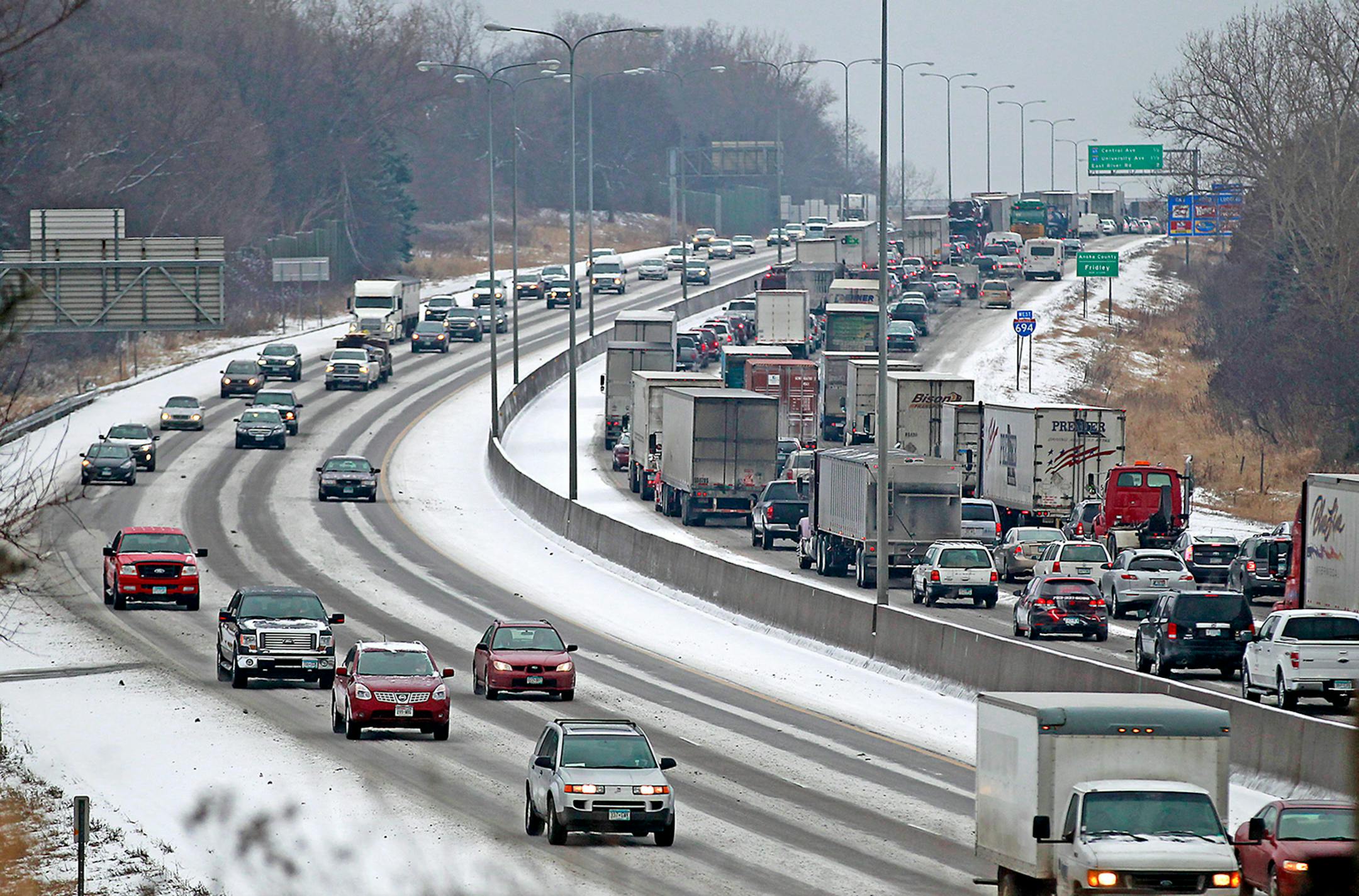 A crash involving a semi-truck slowed traffic on 694 due to snow and freezing rain in February 2015.