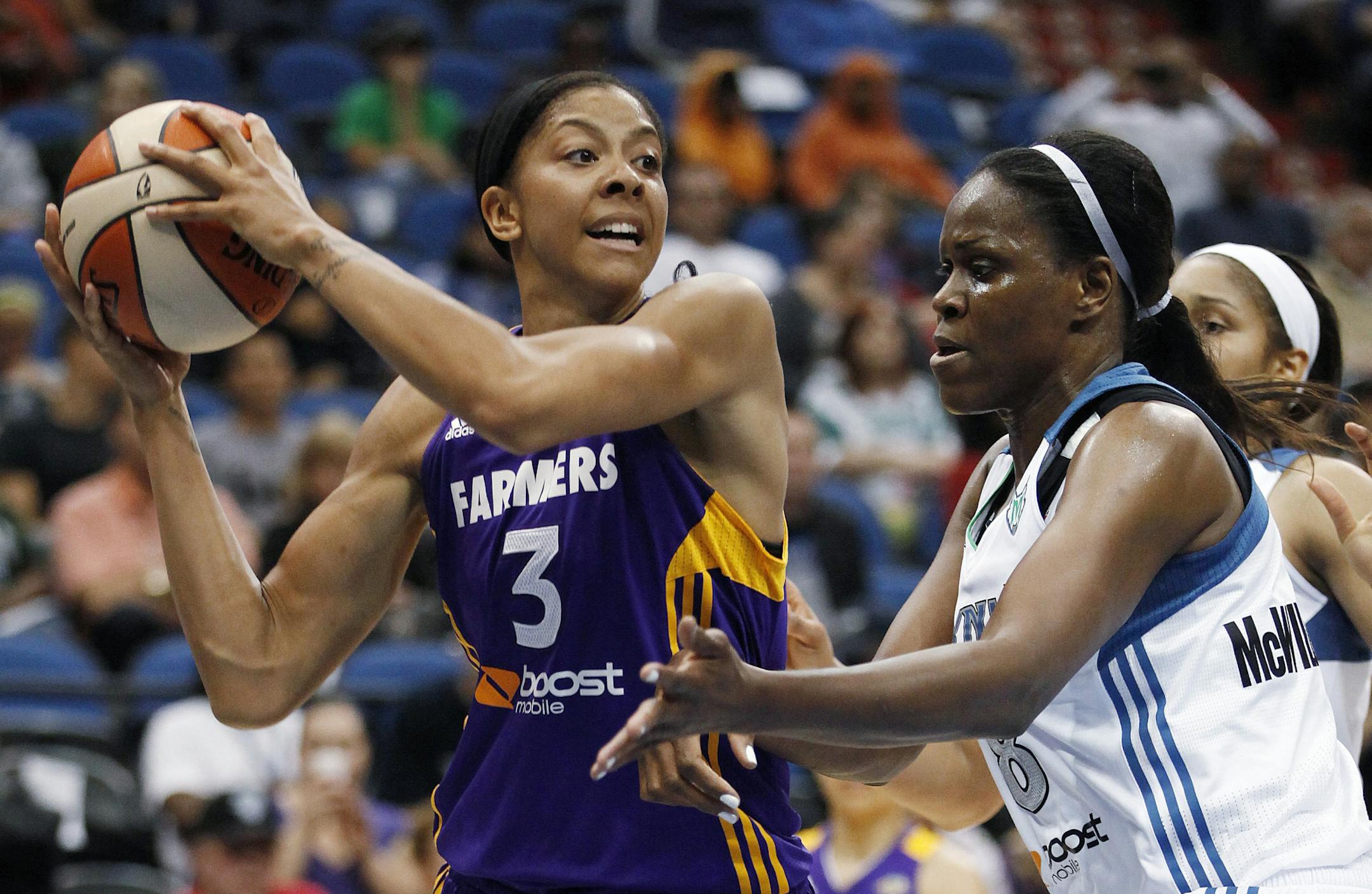 Los Angeles Sparks forward Candace Parker (3) looks to pass as Minnesota Lynx forward Taj McWilliams-Franklin defends last month.