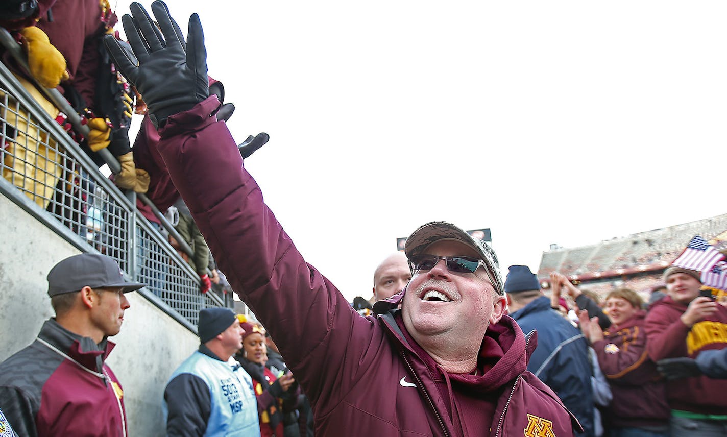 Gophers football coach Jerry Kill greeted fans after Minnesota defeated Iowa 51-14 on Nov. 8. Kill was named Big Ten Coach of the Year on Tuesday after a 5-3 conference finish.