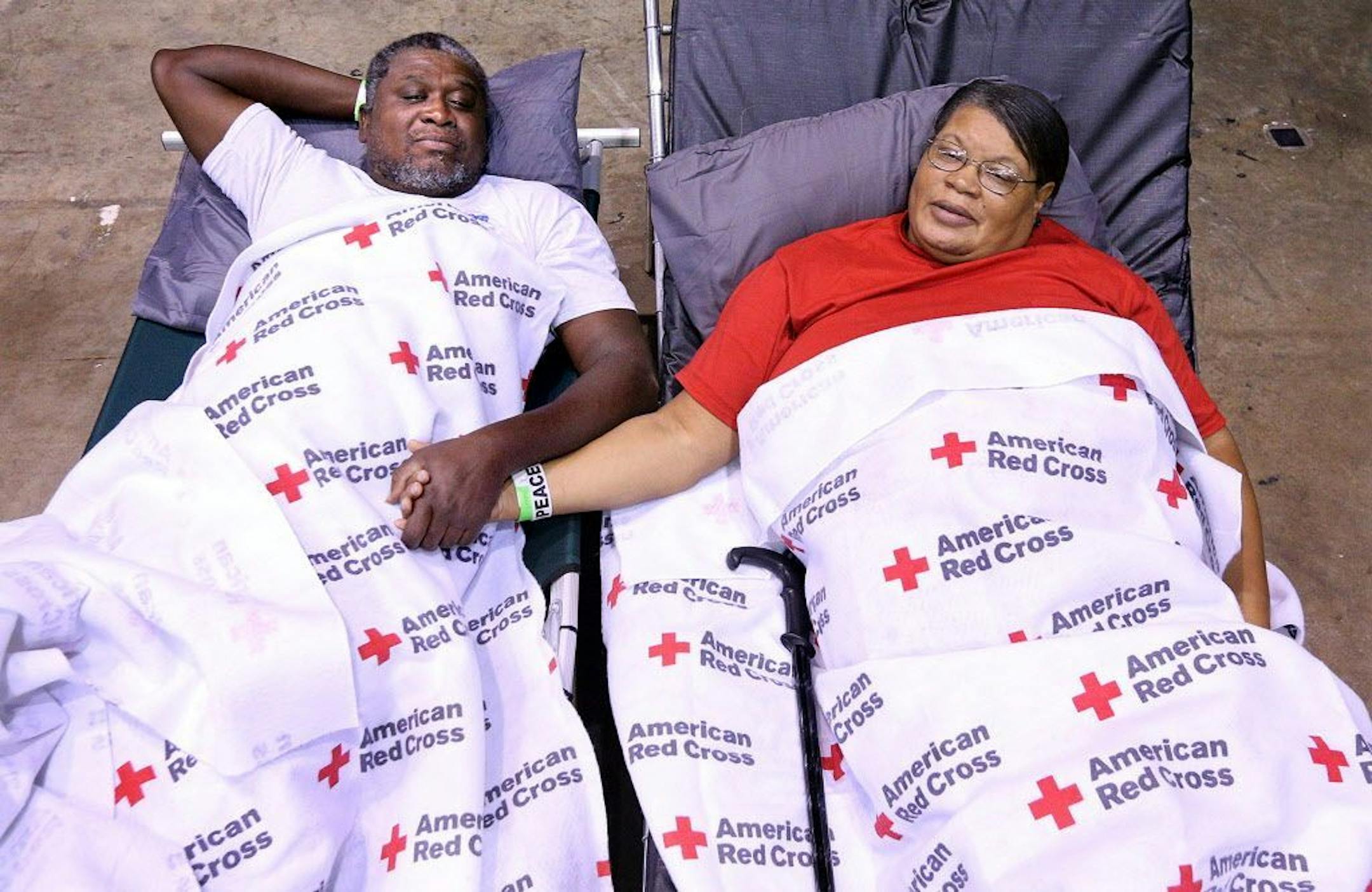 Clarence and Virginia Robinson move into the Red Cross shelter at the Albany Civic Center to ride out Hurricane Irma on Sunday, Sept. 10, 2017, in Albany, Ga. The couple survived Tropical Storm Alberto in 1994, a storm that killed five people in Dougherty County, and more recently two tornado strikes in January of this year that killed four. Virginia Robinson said, "I feel more safe here and our street is already flooding."