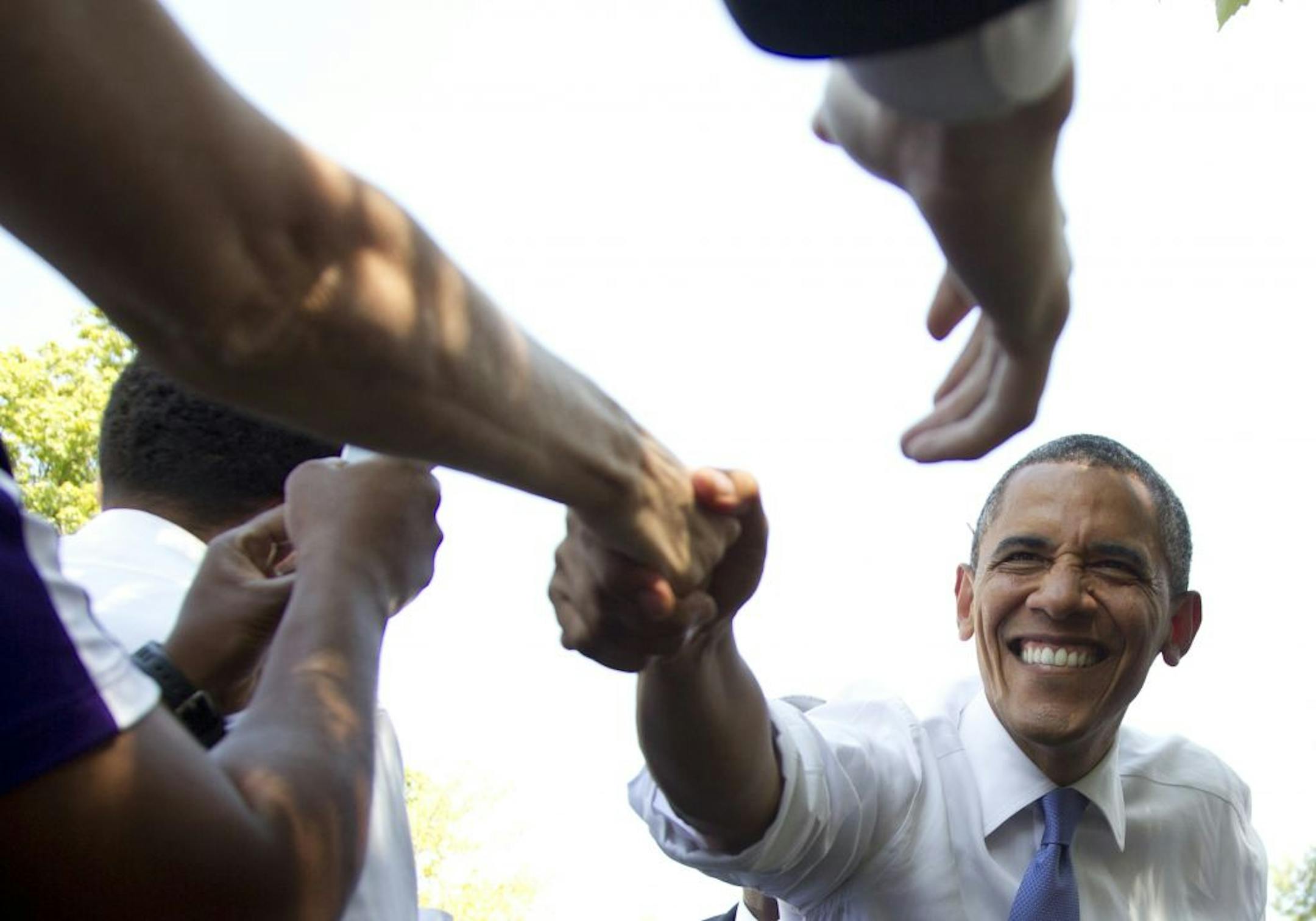 President Barack Obama reaches out to shake hands after speaking at a campaign event at Capital University, Tuesday, Aug. 21, 2012, in Columbus, Ohio.