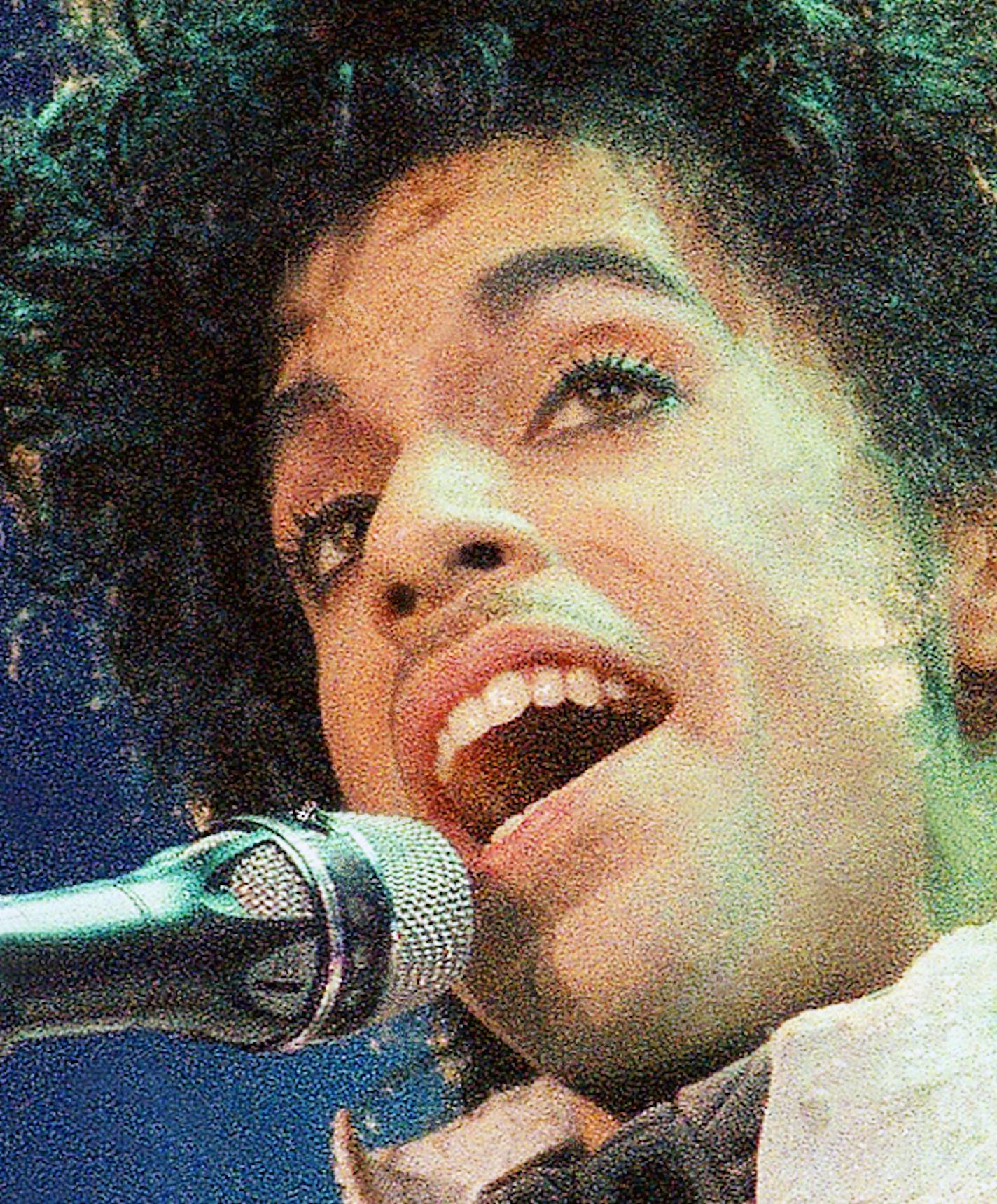 FILE - In this Feb. 18, 1985 file photo, Prince performs at the Forum in Inglewood, Calif. Prince, widely acclaimed as one of the most inventive and influential musicians of his era with hits including "Little Red Corvette," ''Let's Go Crazy" and "When Doves Cry," was found dead at his home on Thursday, April 21, 2016, in suburban Minneapolis, according to his publicist. He was 57. (AP Photo/Liu Heung Shing, File)