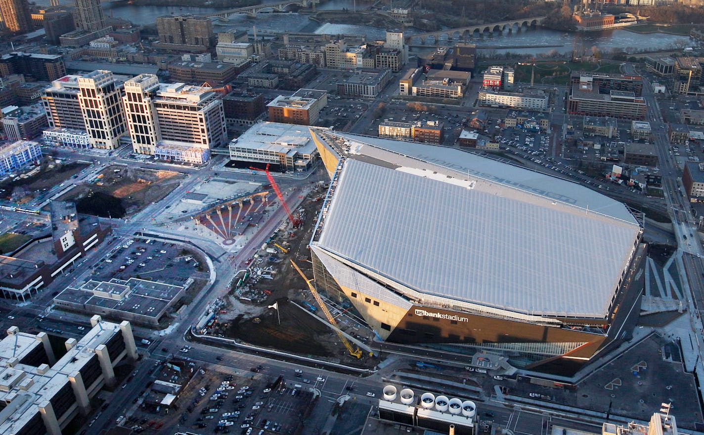 This overhead view is the reason why the Minnesota Vikings want to stop Wells Fargo from putting up mounted, illuminated signs on the rooftops of its two new Minneapolis office towers, left, saying they violate an agreement and threaten to "photobomb" the image of the U.S. Bank Stadium in Downtown East.