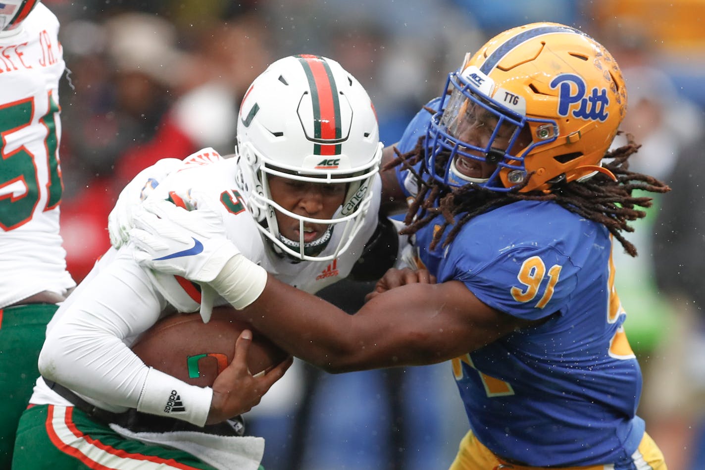 Pittsburgh defensive lineman Patrick Jones II (91) sacks Miami quarterback N'Kosi Perry (5) during the second half of an NCAA college football game, Saturday, Oct. 26, 2019, in Pittsburgh. Miami won 16-12. (AP Photo/Keith Srakocic)