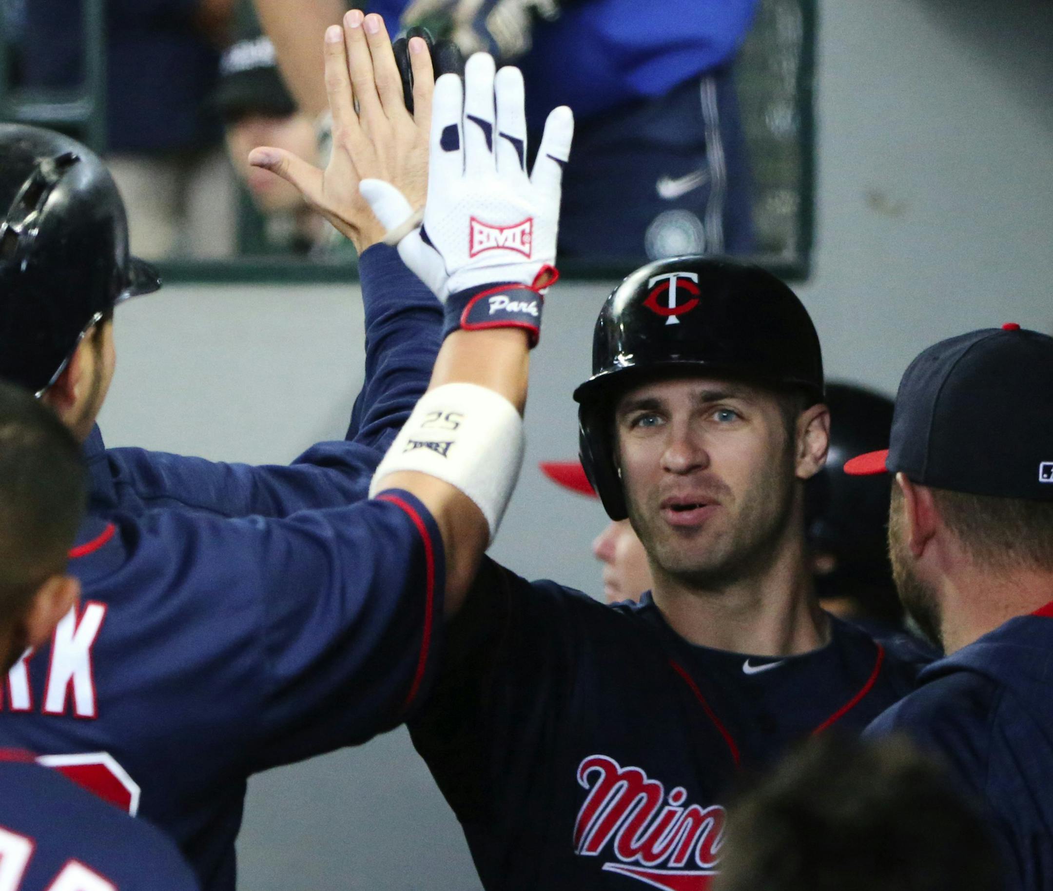 Minnesota Twins designated hitter Joe Mauer celebrates his home run in the dugout during the fourth inning on Sunday, May 29, 2016, at Safeco Field in Seattle. (Ken Lambert/Seattle Times/TNS) ORG XMIT: 1185432