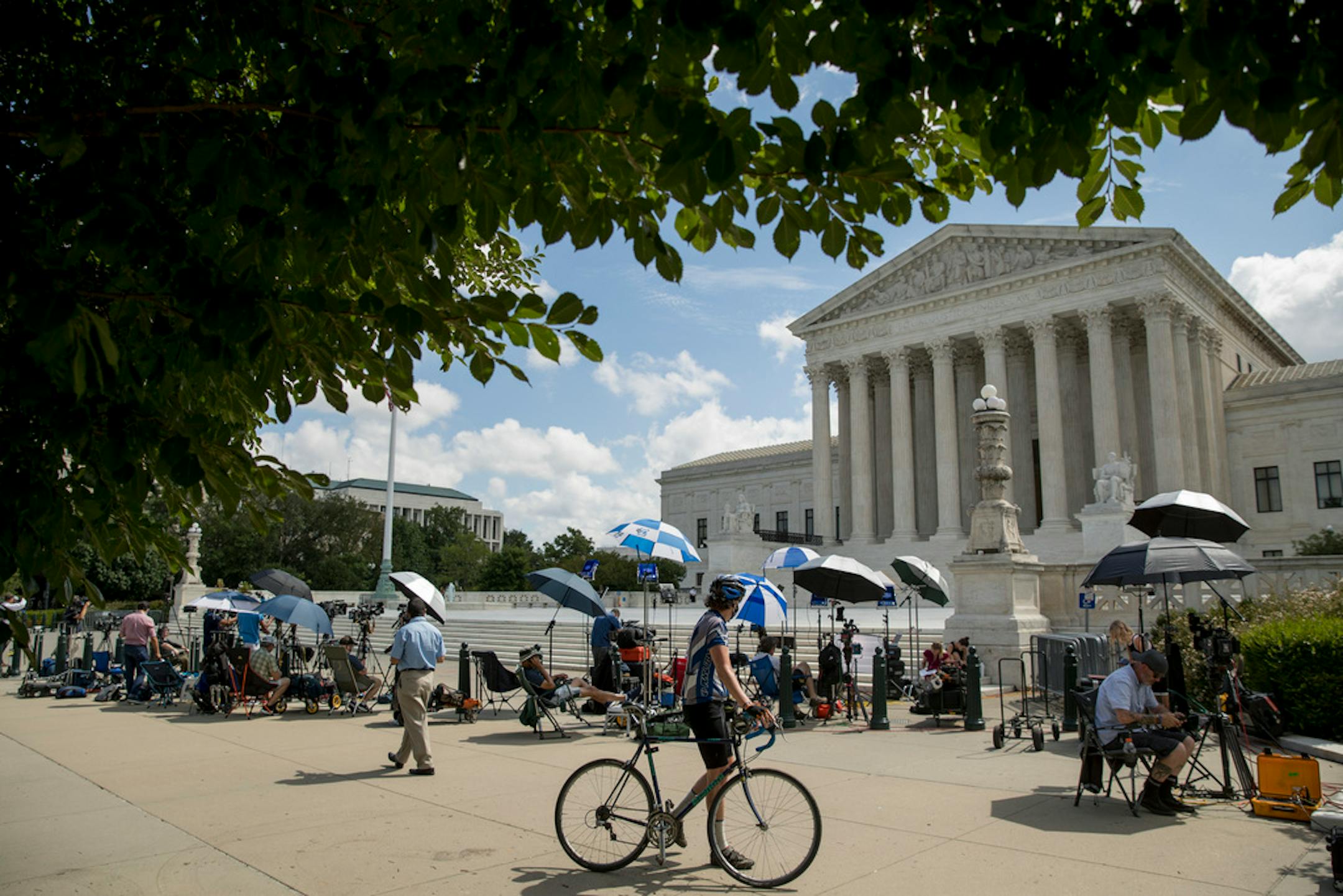 Members of the media set up outside the Supreme Court, Thursday, July 9, 2020, in Washington.