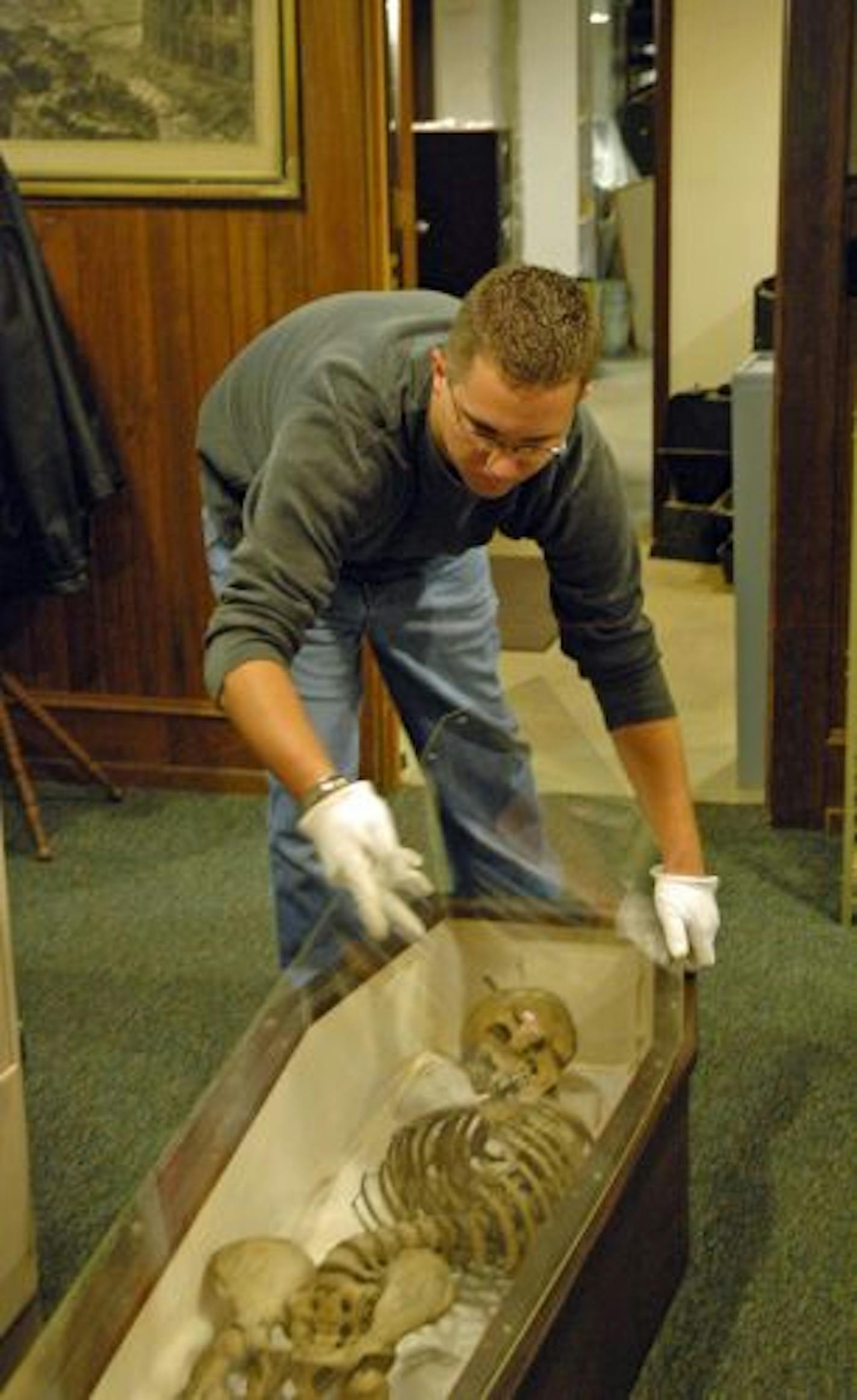 Hayes Scriven, director of the Northfield Historical Society, encased the remains of what was thought to be Charlie Pitts. DNA testing showed the remains do not belong to the James Gang outlaw, but Scriven is not disappointed. "The process has been rewarding."