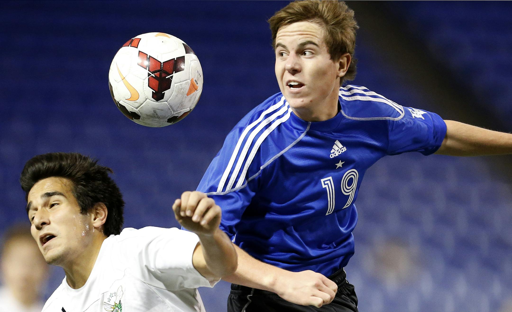Reza Dehkordi (9) of Edina and Matthew Kratz (19) of Eastview battled for the ball in overtime. ] CARLOS GONZALEZ cgonzalez@startribune.com October 28, 2013, Minneapolis, Minn., Mall of America Field - The Metrodome, Class 2A High School / prep boys soccer semifinals.Edina vs. Eastview