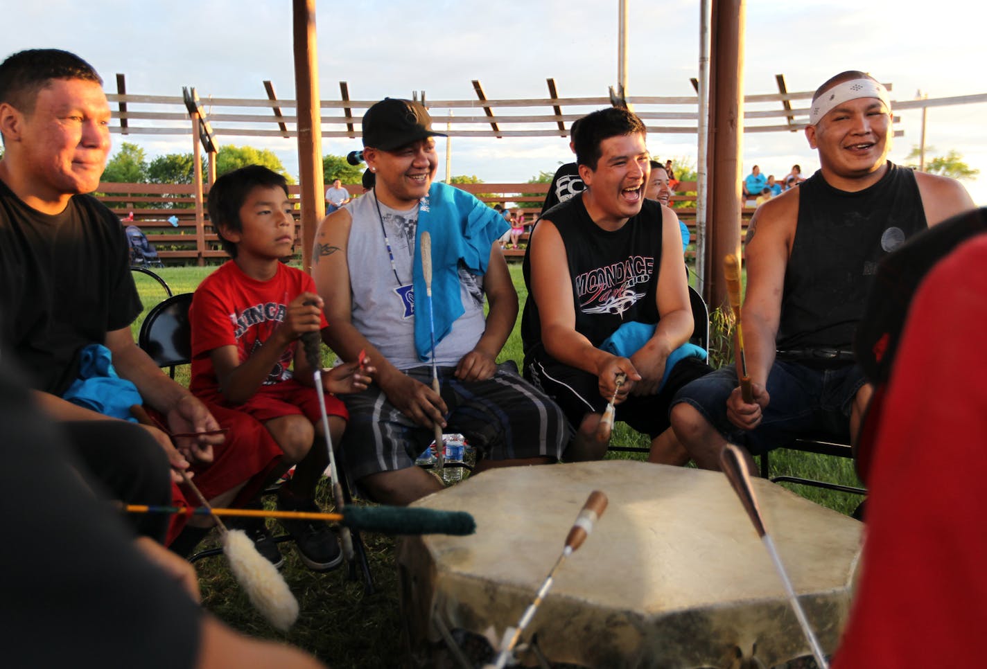 Drummers share a laugh during a celebration for Ojibwe language revitalization at the Red Lake Indian Reservation last week. The tribe is exploring re-writing its constitution, to both better reflect its cultural values and modern government. (ANNA REED/STAR TRIBUNE) anna.reed@startribune.com (cq) ] (ANNA REED/STAR TRIBUNE) anna.reed@startribune.com (cq)