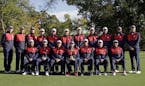 Members of the 2016 United States Ryder Cup team pose for a group photo before a practice round for the Ryder Cup golf tournament Tuesday, Sept. 27, 2
