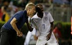 United States coach Jurgen Klinsman, talks to United States� DaMarcus Beasley during the CONCACAF Confederations Cup playoff soccer match against Me