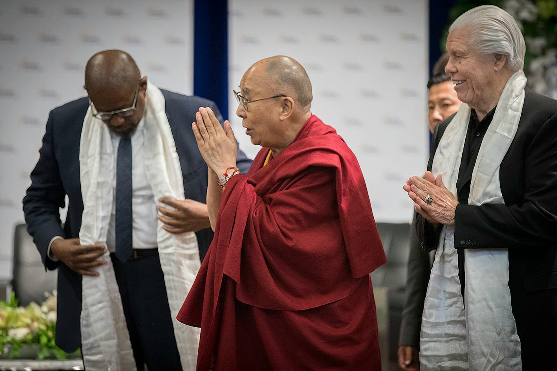 The Dalai Lama presented actor Forest Whitaker, left, and Starkey Hearing Technologies Owner, CEO, and President Bill Austin with a gift after they participated in a panel discussion at Starkey Hearing Technologies, Friday, June 23, 2017 in Eden Prairie, MN.