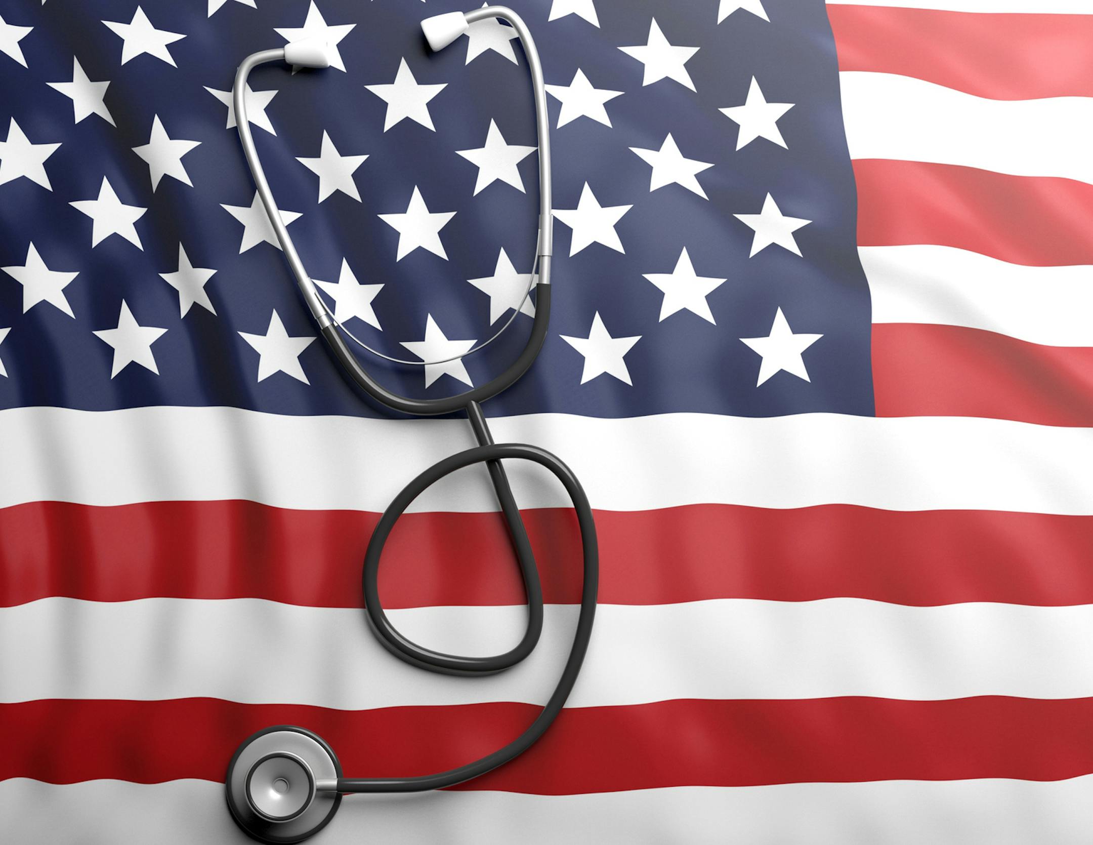 iStock
Stethoscope on USA flag background.