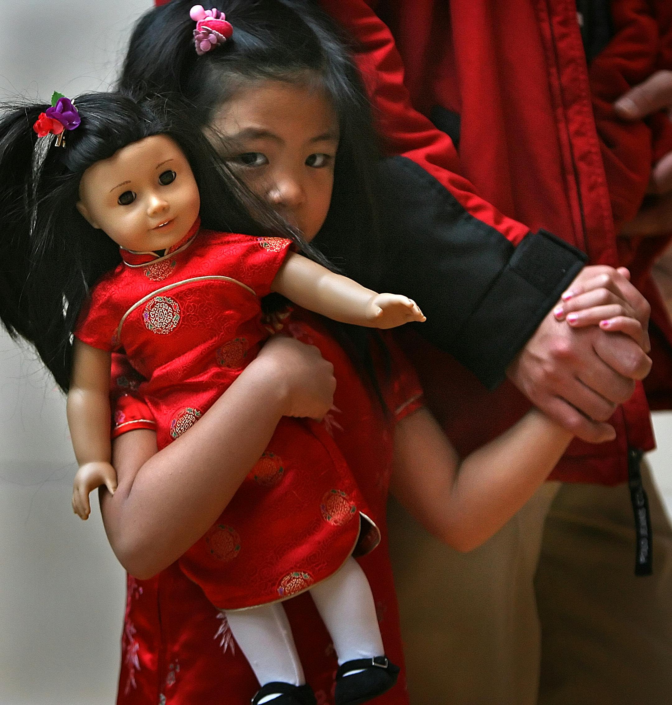 JIM GEHRZ � jgehrz@startribune.com Bloomington/November 15, 2008/9:00 AM Kristen Lacsamana, 5, Edina, held the hand of her father, Ariel and her doll, Ivy, outside The American Girl Store at the Mall of America on the opening day. Hundreds of doll enthusiasts showed up to explore the new store and to shop for dolls, accessories and even to have their doll�s hair styled or to get their doll�s ears pierced.