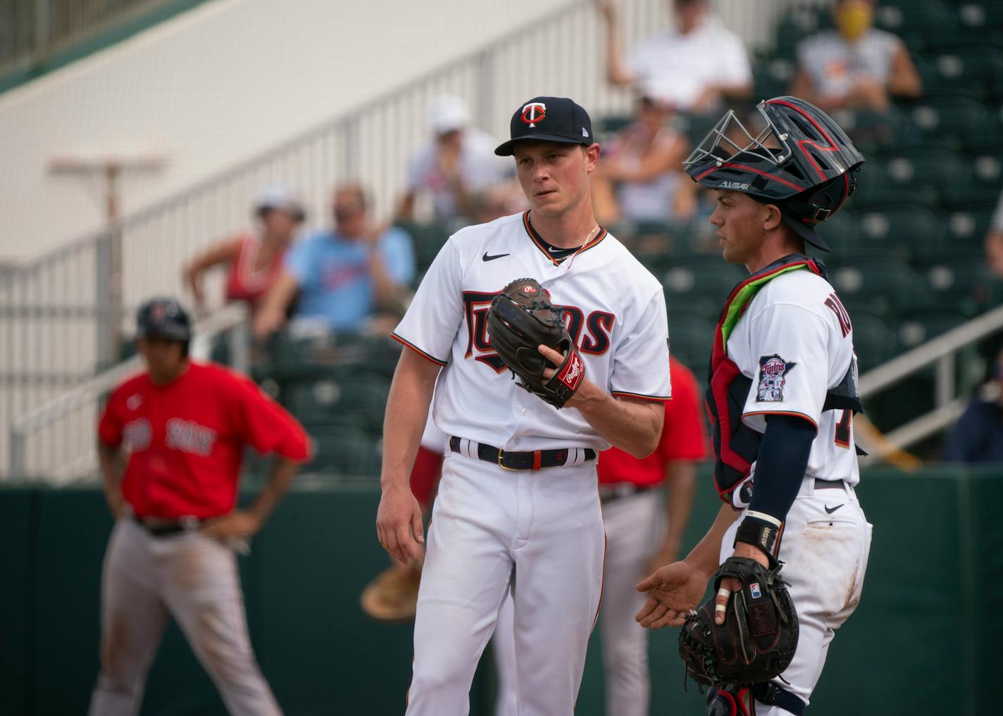 Twins catcher Ben Rortvedt visited with relief pitcher Cody Stashak during a game on Feb. 28.