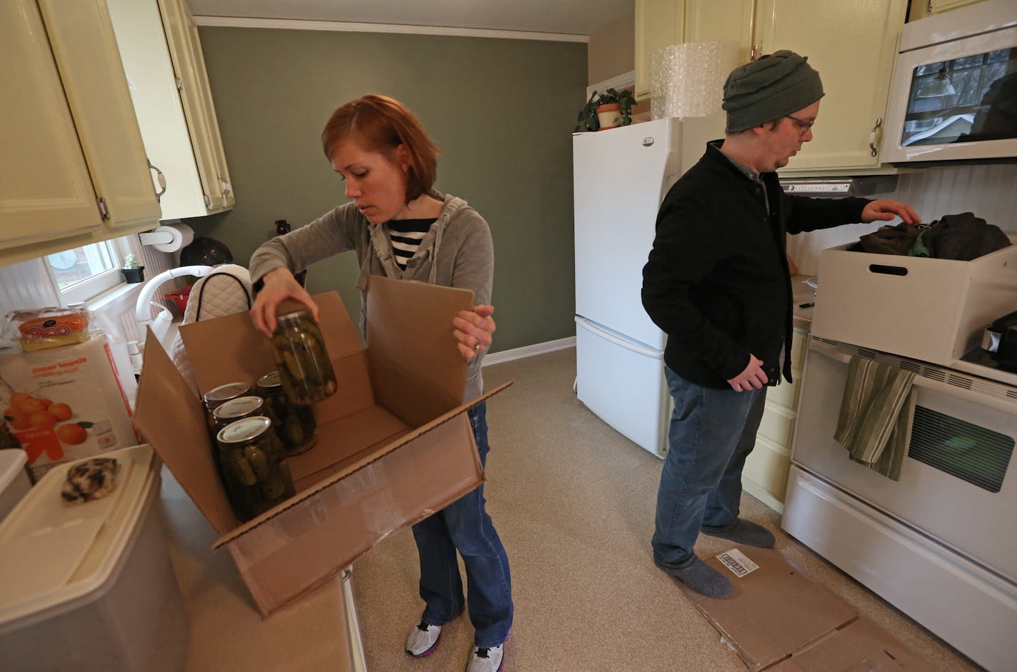 Karen and Mark Swoverland packed up items in the kitchen, on 4/30/14, as they moved to an apartment after selling their house in south Minneapolis.