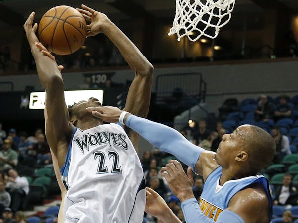 Andrew Wiggins (22) was fouled by Randy Foye (4) in the second quarter.