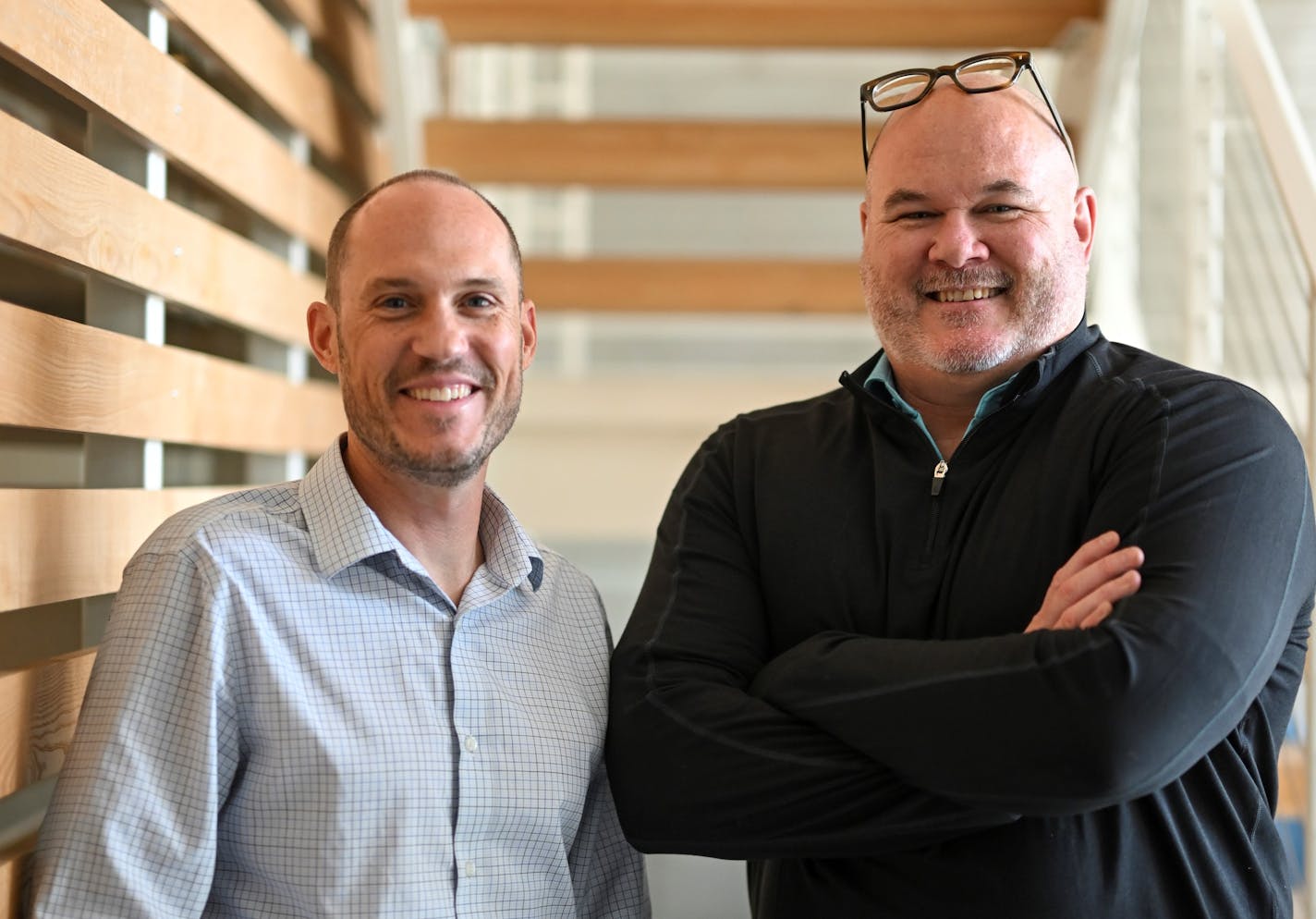 Scott Moore, right, and Brian Bispala stand for a portrait Tuesday, Sept. 6, 2022 at the B-Swing offices in Minneapolis, Minn.. The two are founders of Colaboratory, a startup that will use an algorithm to pair brands that want to create joint products and marketing campaigns. ] aaron.lavinsky@startribune.com