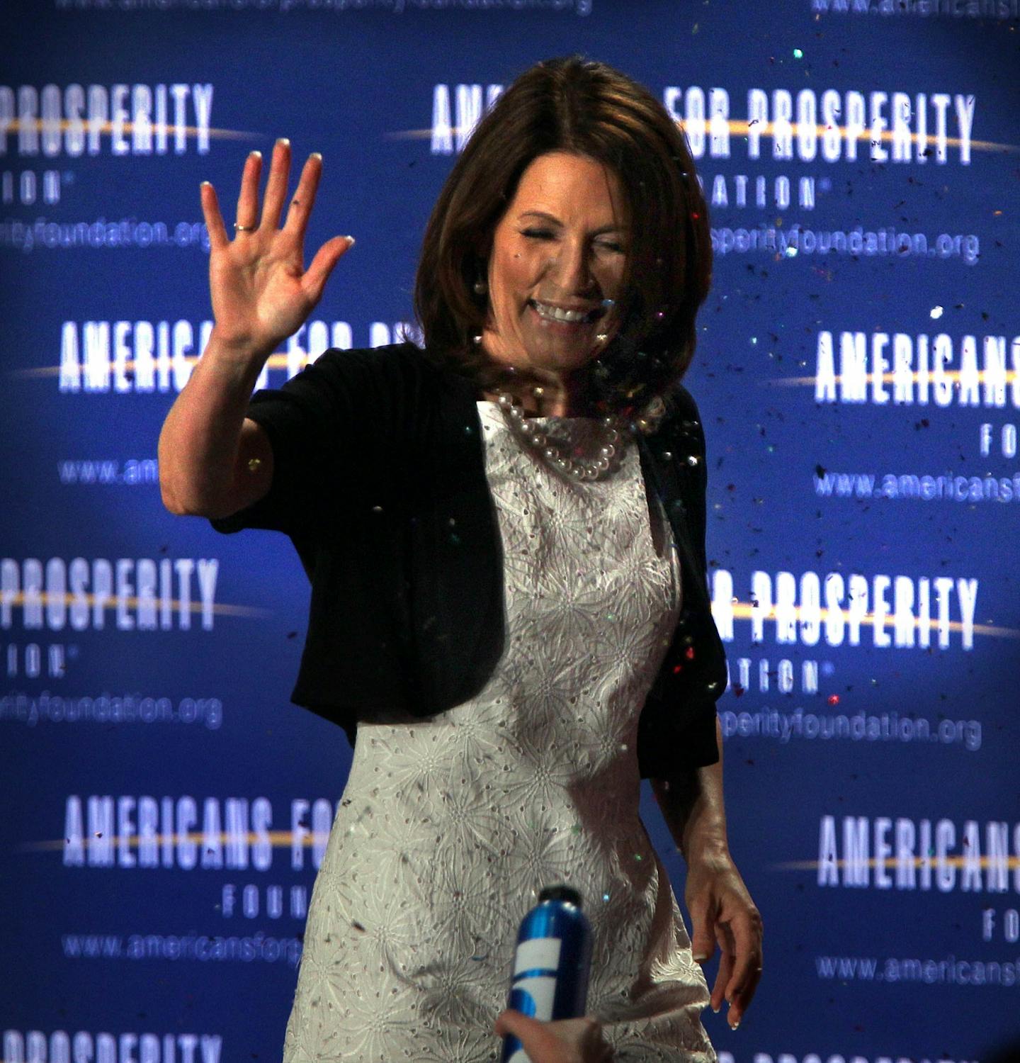 Bachmann takes glitter protest in stride with photo