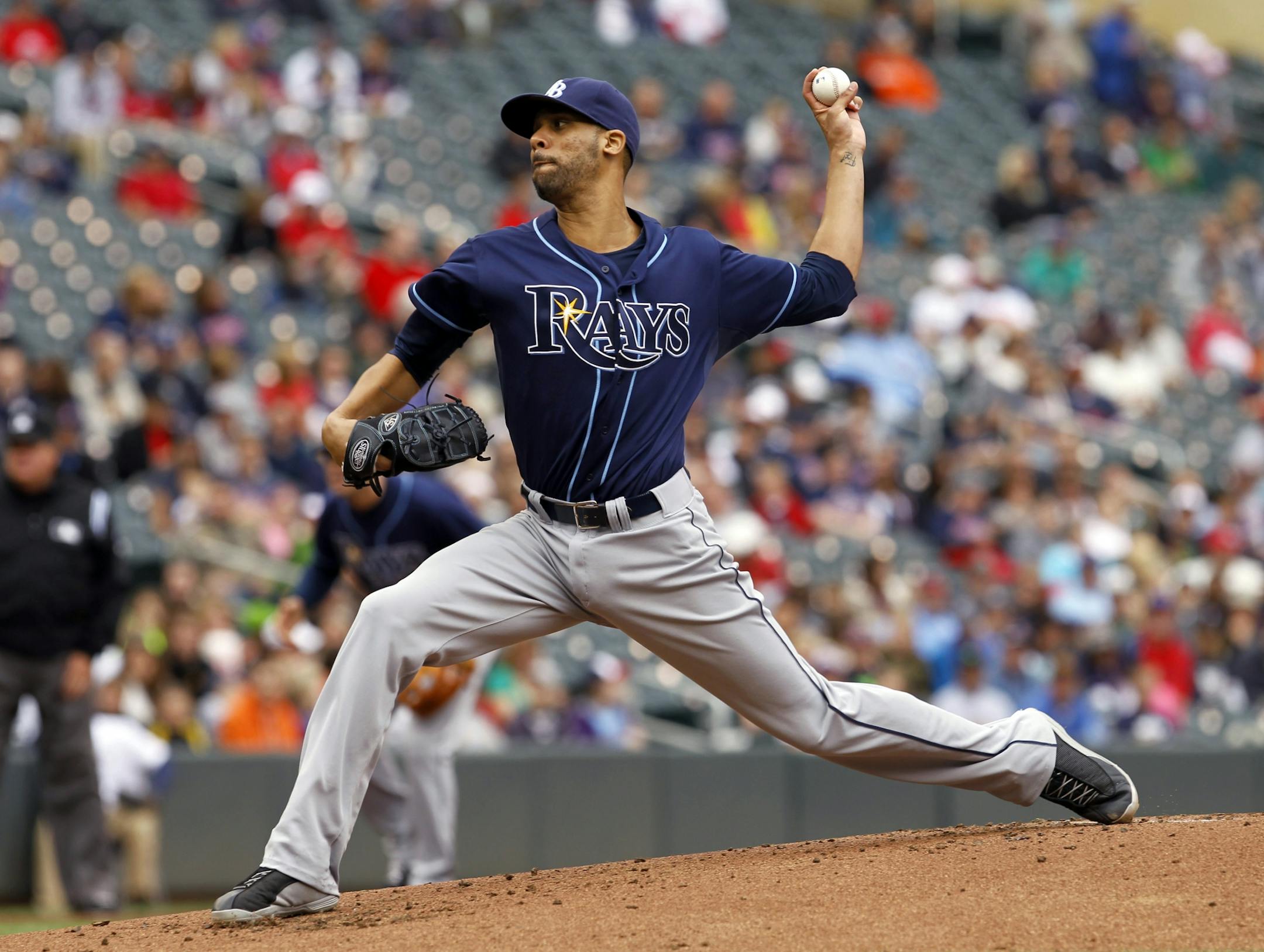 Tampa Bay Rays pitcher David Price delivers to the Minnesota Twins during the first inning of a baseball game, Sunday, Sept. 15, 2013, in Minneapolis.