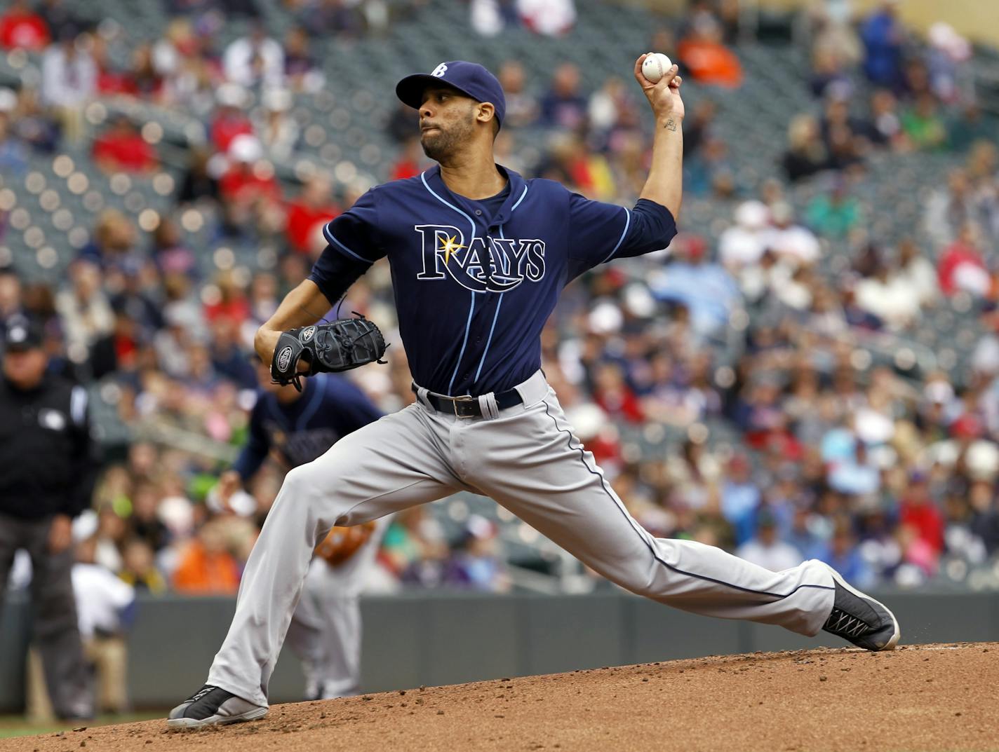 Tampa Bay Rays pitcher David Price delivers to the Minnesota Twins during the first inning of a baseball game, Sunday, Sept. 15, 2013, in Minneapolis.