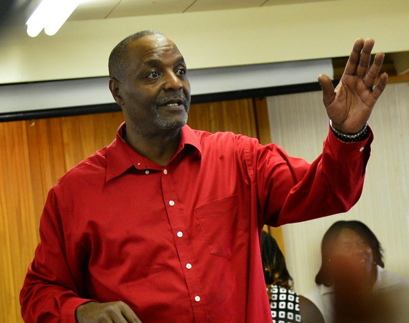 In this 2014 file photo, Al Flowers directed a meeting of community leaders and police officials about the recent outbreak of violence on north side of Minneapolis.