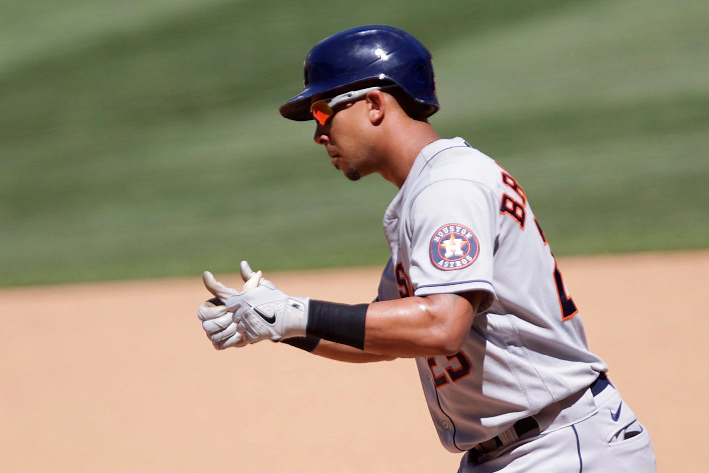 Houston Astros left fielder Michael Brantley gives thumbs up after hitting a 2 RBI single in the seventh inning of a baseball game against the Minnesota Twins, Sunday, June 13, 2021, in Minneapolis. The Astros defeated the Twins 14-3. (AP Photo/Andy Clayton-King)