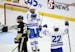 Minnetonka forward Gavin Garry (15) and forward Javon Moore (22) react after Garry scored a goal against Andover with an assist from Moore during the 