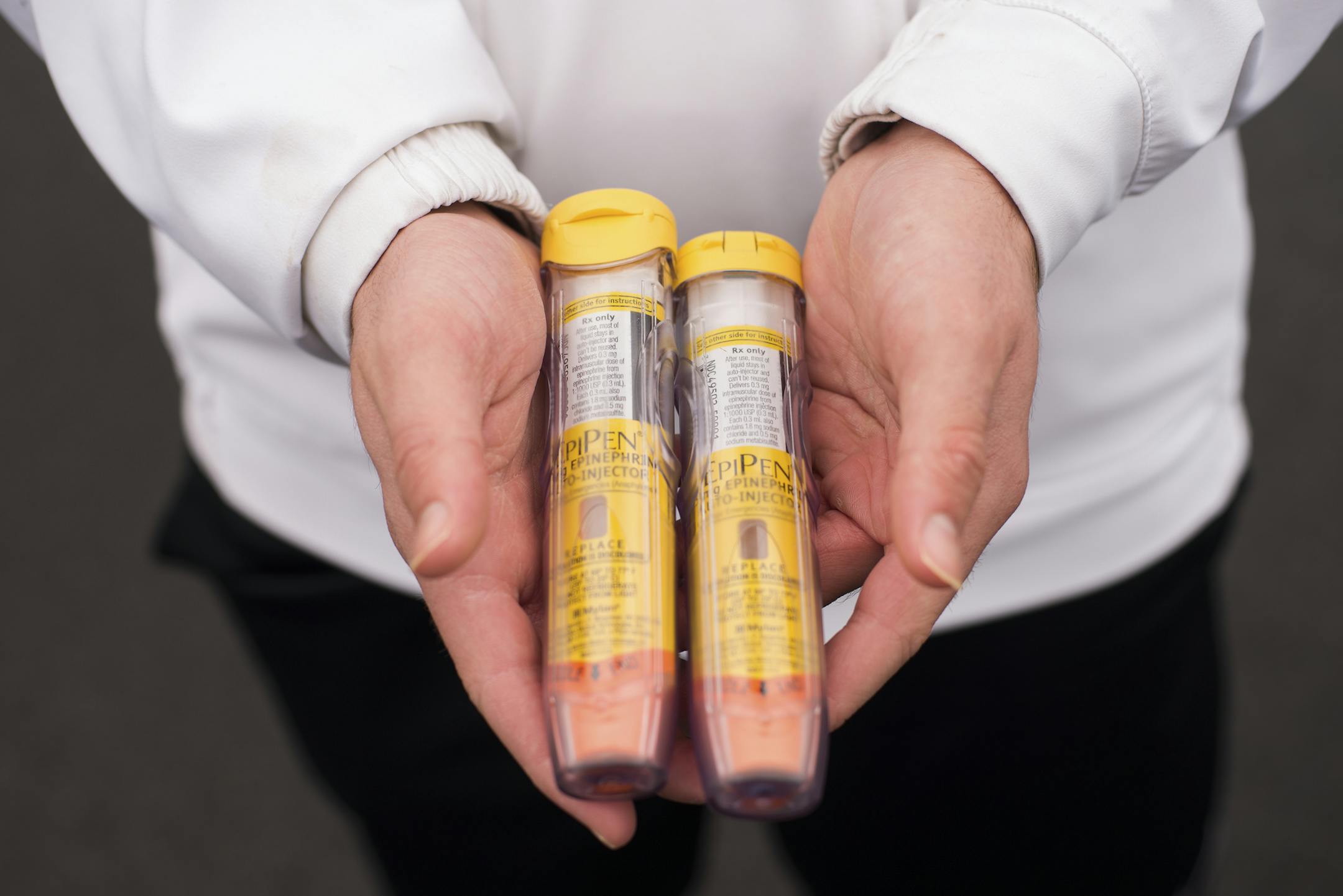 Dr. Roseanne Bloom holds her sonsí Epi-Pens, which they carry with them whenever they leave the house in case of a life-threatening allergic reaction, in Clarksville, Md., Jan. 22, 2017. On Christmas morning, the family was removed from an American Airlines flight because of concerns about the boysí nut allergies. (Andrew Mangum/The New York Times)