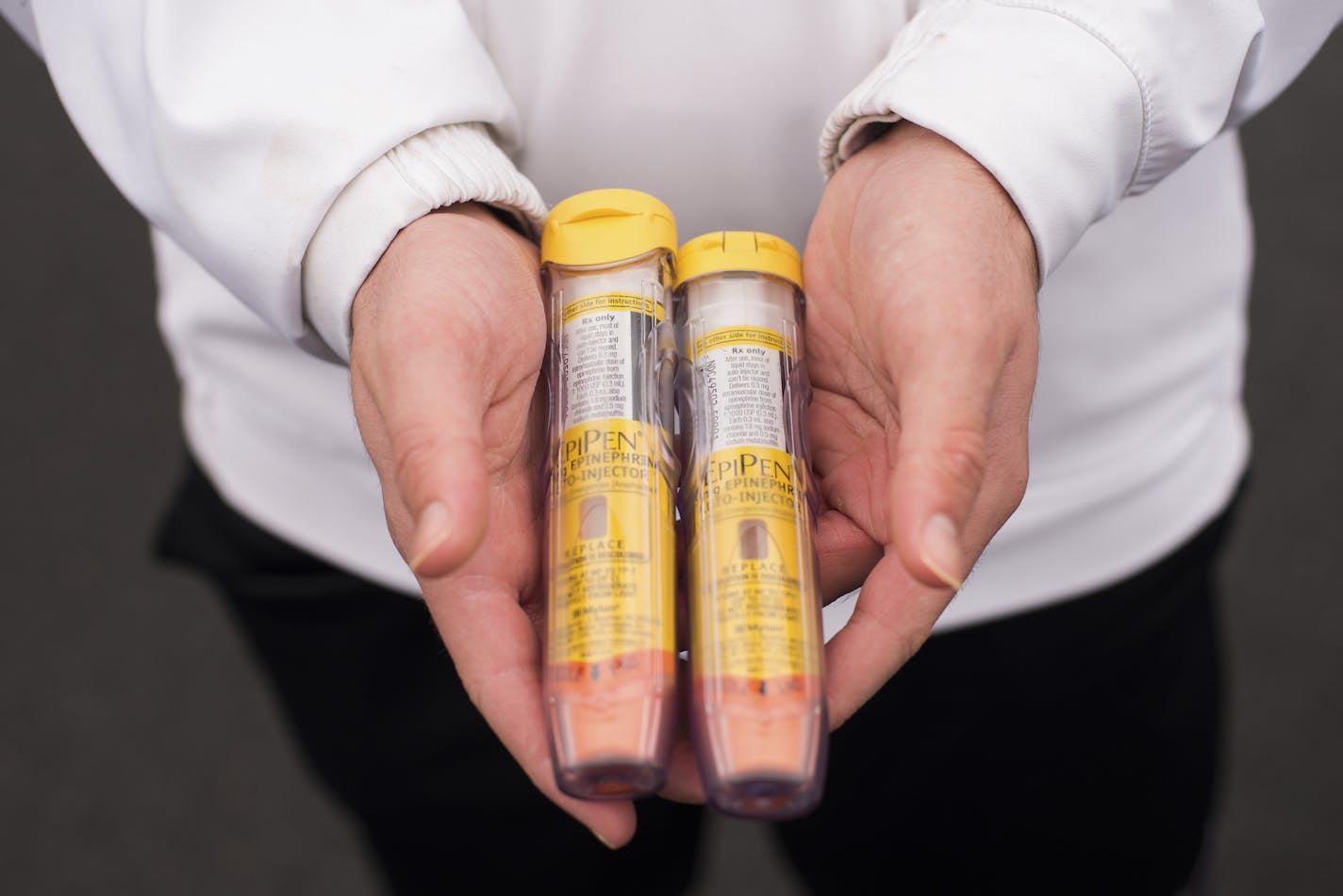 Dr. Roseanne Bloom holds her sons&#xed; Epi-Pens, which they carry with them whenever they leave the house in case of a life-threatening allergic reaction, in Clarksville, Md., Jan. 22, 2017. On Christmas morning, the family was removed from an American Airlines flight because of concerns about the boys&#xed; nut allergies. (Andrew Mangum/The New York Times)