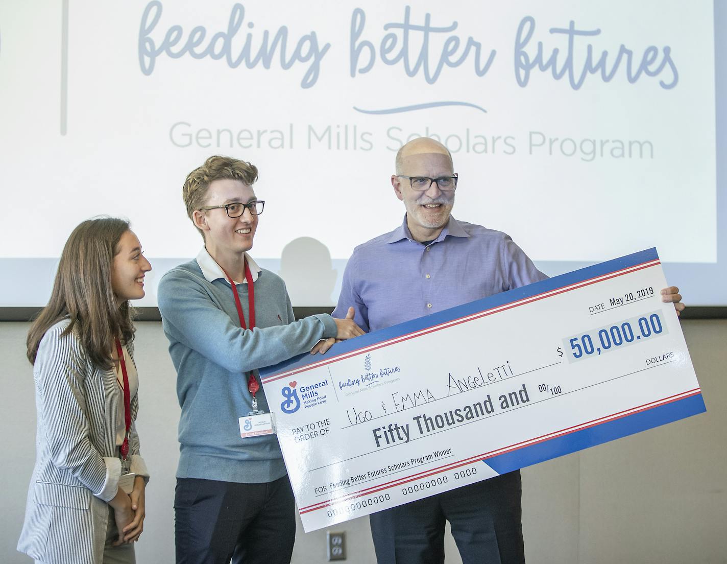 Siblings Ugo and Emma Angeletti, were greeted by General Mills CEO Jeff Harmening after he announced that they were the $50,000 winners of the company's Feeding Better Futures scholarship. The siblings started "back2earth," a Miami-based community composting service. Other finalists were Kenzie Hinson, left, and Bradley Ferguson, right. The contest calls on young adults ages 13-21, to share how they're tackling hunger, food waste and sustainable agriculture in their own communities. ] ELIZABETH