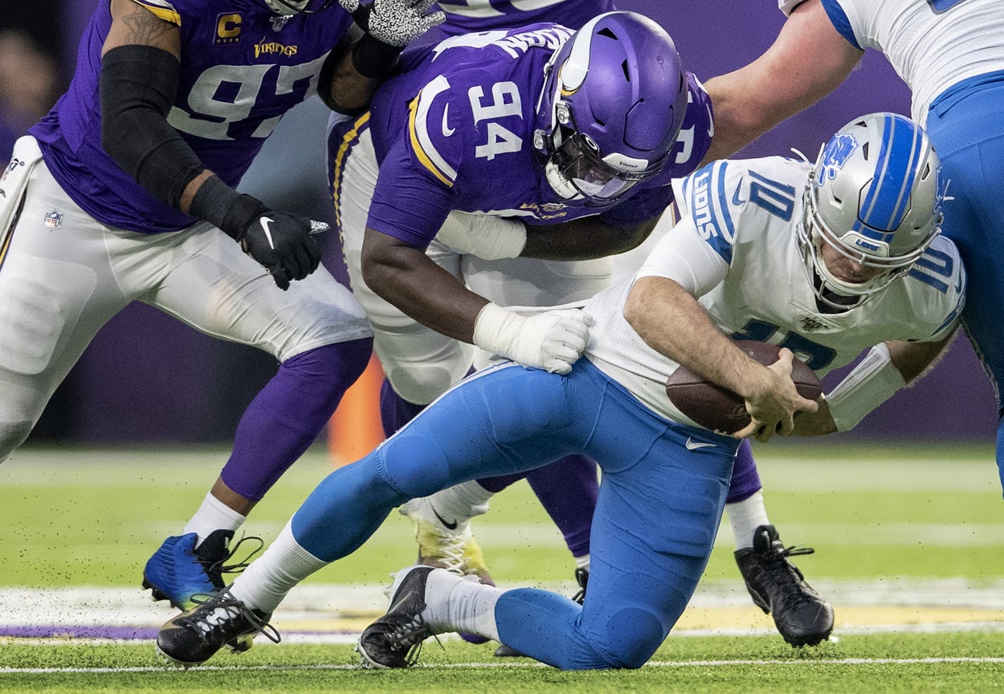 Minnesota Vikings' Jaleel Johnson (94) sacked Detroit Lions quarterback David Blough (10) in the second quarter.