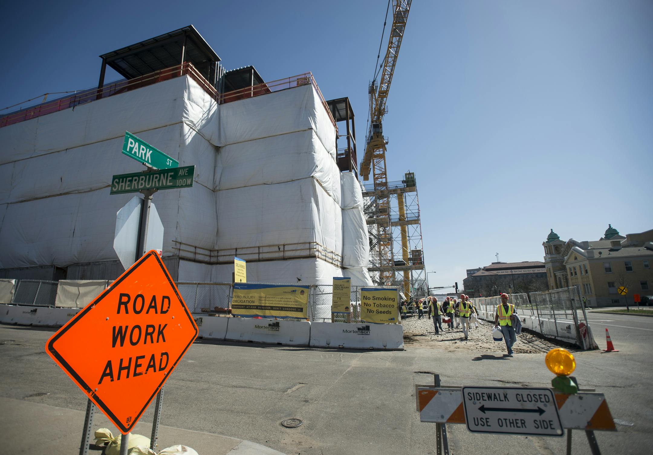 Workers leave the Senate Office Building construction site at the end of Tuesday's work day. ] (Aaron Lavinsky | StarTribune) aaron.lavinsky@startribune.com Mortenson Construction gave the media a tour of the new Senate Office Building construction, a project that has been criticized over spending by Republicans. The building is being built in conjunction with the capitol renovation and will house senators displaced by the capitol project. The tour was photographed Tuesday, April 14, 2015 in St.