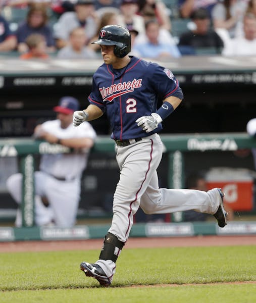 The Twins' Brian Dozier circled the bases after hitting a solo home run off Indians starter Scott Kazmir in the sixth inning Friday.