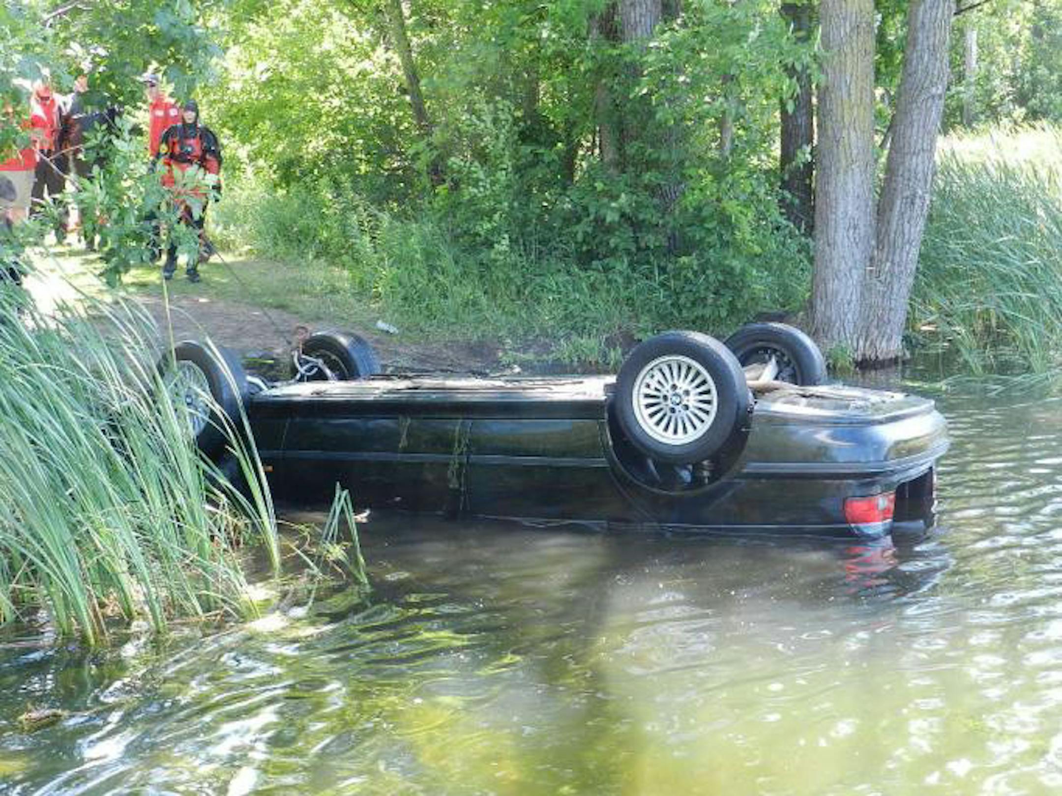 The submerged car emerges from Loeb Lake at Marydale Park in St. Paul