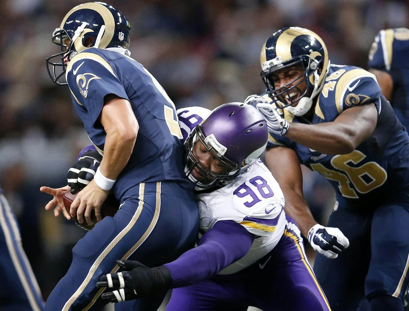 Vikings Linval Joseph (98) sacked Rams quarterback Austin Davis (9) in the third quarter.