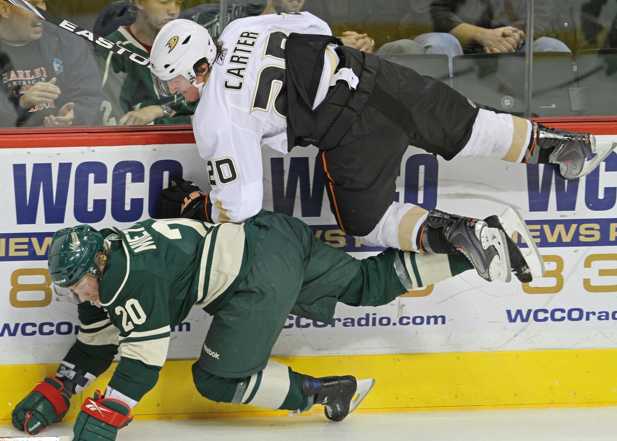 Minnesota Wild vs Anaheim Ducks, (left to right) The Wild's Antti Miettinen and Duck's Ryan Carter went flying as they battled for the puck in 3rd period action.
