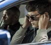 This image released by Sony Pictures shows Ansel Elgort, right, and Jamie Foxx in a scene from "Baby Driver." (Wilson Webb/Sony/TriStar Pictures via A