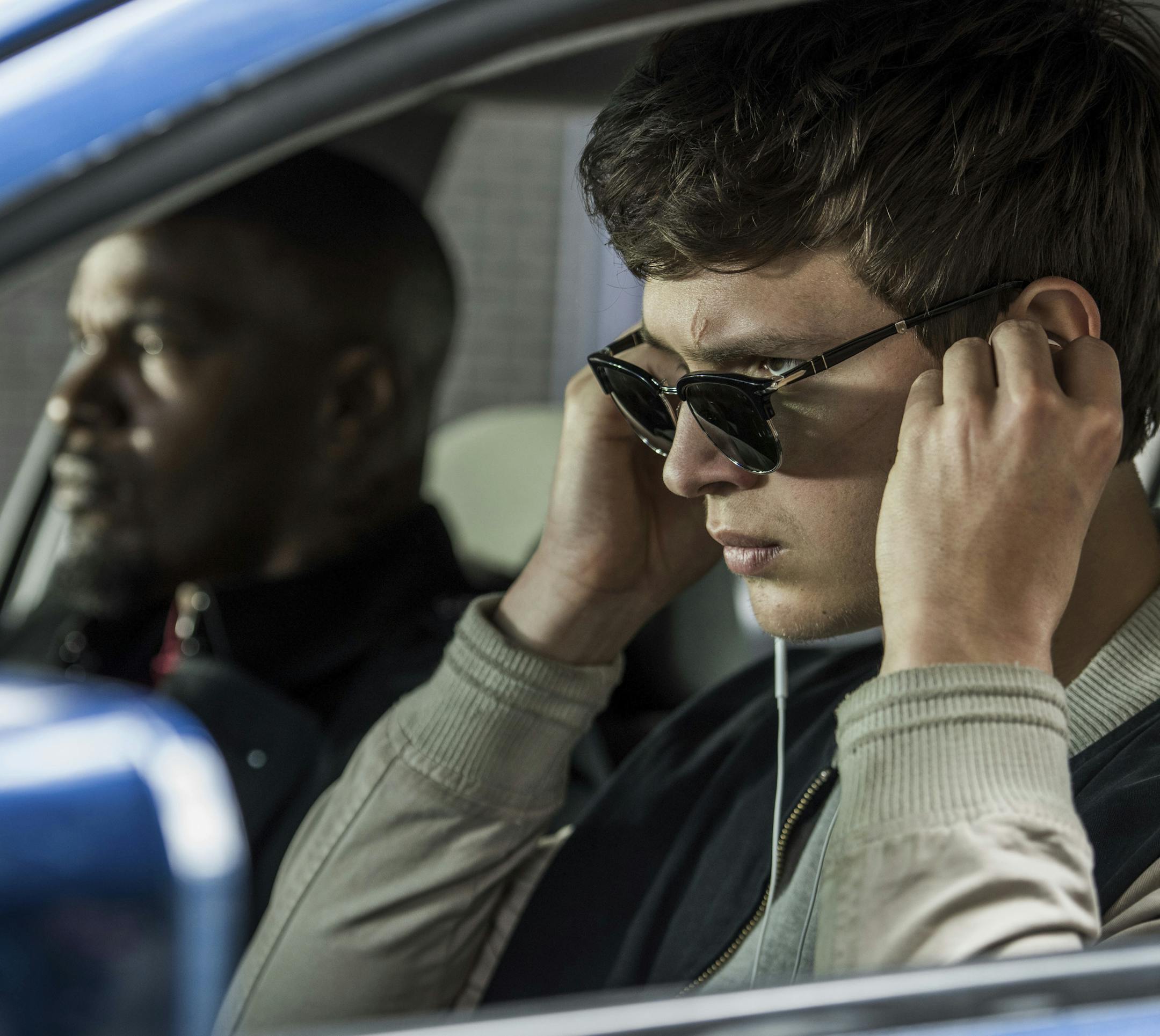 This image released by Sony Pictures shows Ansel Elgort, right, and Jamie Foxx in a scene from "Baby Driver." (Wilson Webb/Sony/TriStar Pictures via AP)