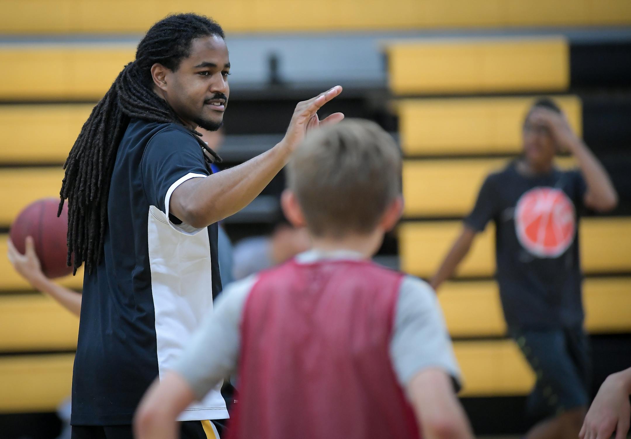 Delasalle head coach Travis Bledsoe gestured to kids taking part in a basketball camp at Delasalle High School Thursday. ] AARON LAVINSKY ï aaron.lavinsky@startribune.com All-zone feature on three boys' basketball coaches who are directing new programs this season. We photograph Delasalle head coach Travis Bledsoe as he coaches a youth camp Thursday, June 29, 2017 at Delasalle High School in Minneapolis, Minn.