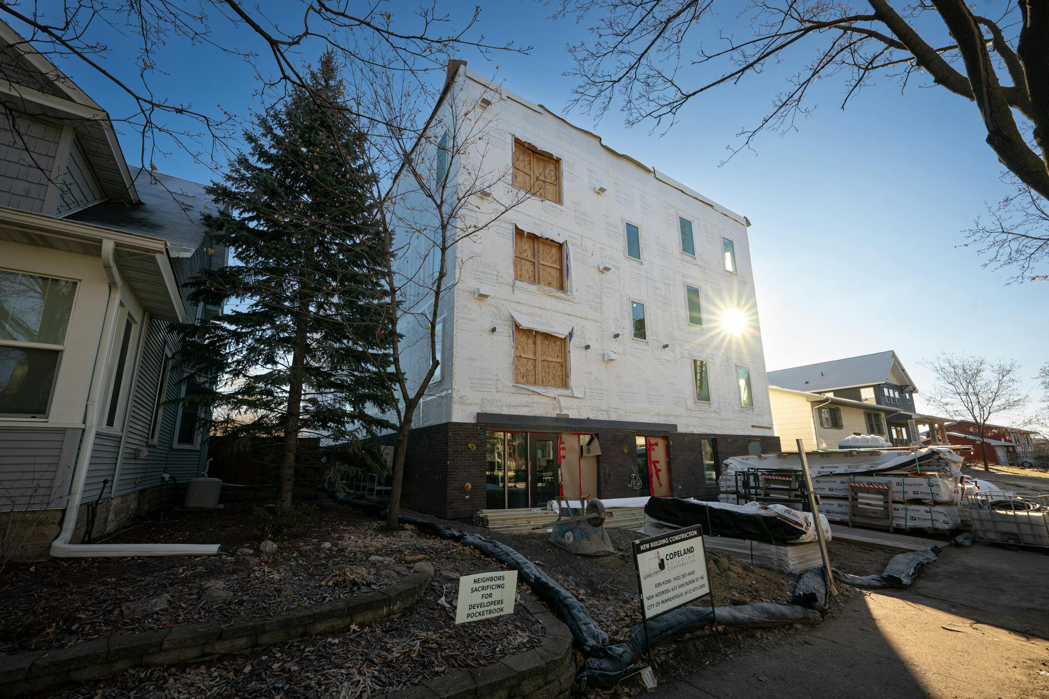 Cody Fischer, who owns Footprint Development, works on getting this project at 635 Van Buren St. NE completed for leasing Friday, Dec. 29, 2023 Minneapolis, Minn. The building has gone through lots of ups and down as a result of the 2040 litigation. It is now almost complete, but another one of Fischer's projects at Minnehaha and 36th is completely stalled. ] GLEN STUBBE • glen.stubbe@startribune.com