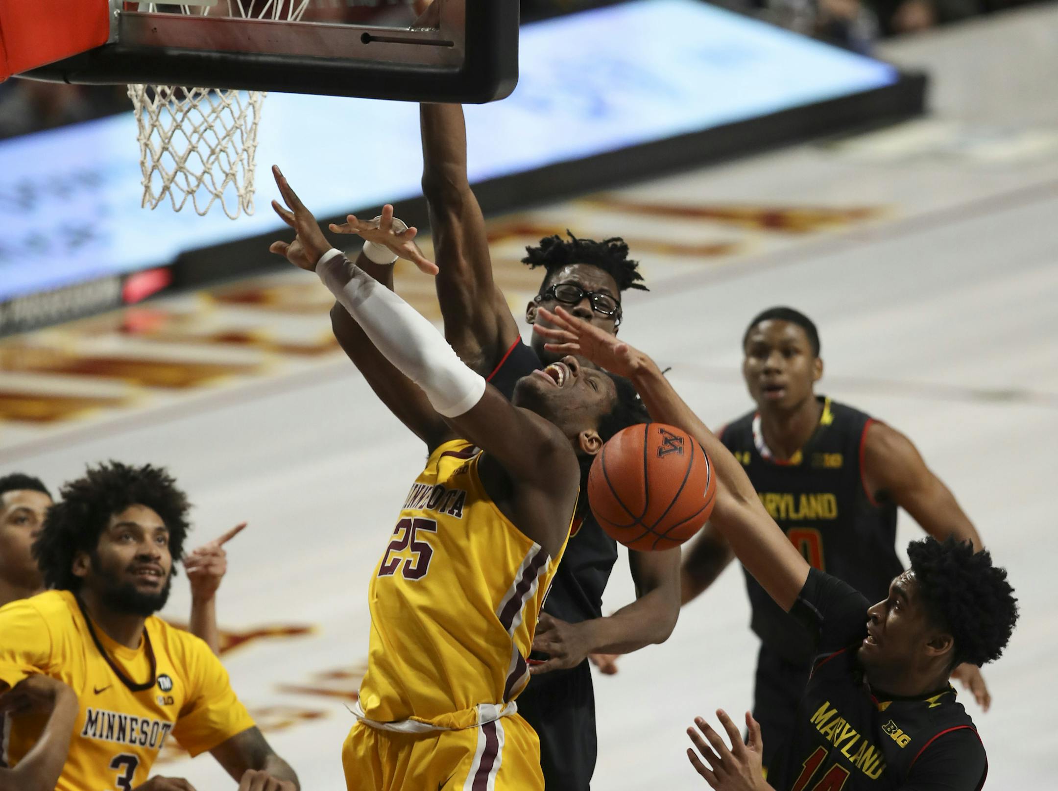 Gophers center Daniel Oturu (25) lost control of the ball under the net while being guarded by Maryland Terrapins forward Ricky Lindo Jr. (14) in the second half. ] JEFF WHEELER &#x2022; jeff.wheeler@startribune.com The University of Minnesota men's basketball team lost to the University of Maryland 82-67 in an NCAA basketball game Tuesday night, January 8, 2019 at Williams Arena in Minneapolis.